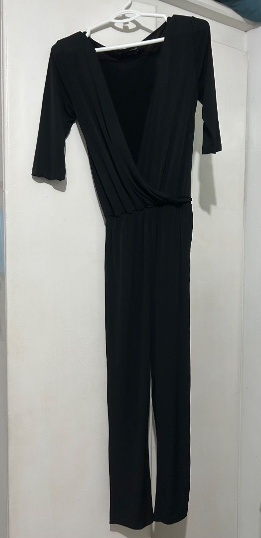 Black Jumpsuit with Gartered Waist (Category: Jumpsuits) located in Manila. Submitted by djlfets (Listing ID 1419065914, Image 1). Description: - Black wrap-like jumpsuit - A hand-me-down jumpsuit - Three-quarter sleeves - Elasticated waist - Soft, flowing fabric - Can fit S-Semi-M - Open front design - Versatile for evening or casual wear -RFS: doesn’t flatter my body; giving way to others who can use and enjoy it.