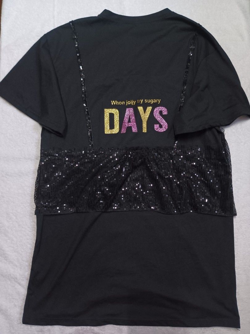Black Sequin Embellished T-shirt (Category: Shirts) located in Malabon City. Submitted by mslalan (Listing ID 1419108084, Image 3). Description: - Black t-shirt - Sequin embellished - Layered design with sequined panel (chest and back) - "DAYS" graphic on the back - Short sleeves - Round neckline.