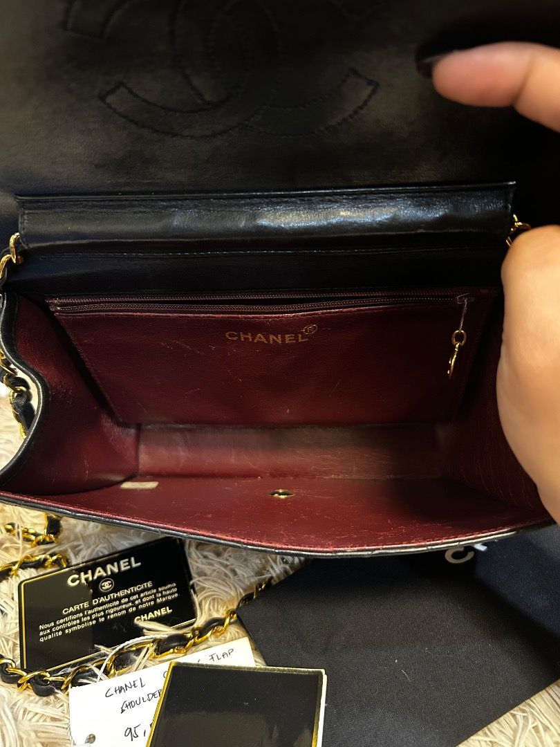 Chanel Classic Flap Shoulder Bag (Category: Luxury Bags & Wallets) located in Caloocan City. Submitted by piamariemo11606 (Listing ID 1419109111, Image 3). Description: - Authentic Chanel Classic Flap shoulder bag - Black, quilted design - Gold-tone chain strap - Iconic CC turn-lock closure - Includes original box, dust bag, and authenticity cards - Red leather interior with zippered pocket.