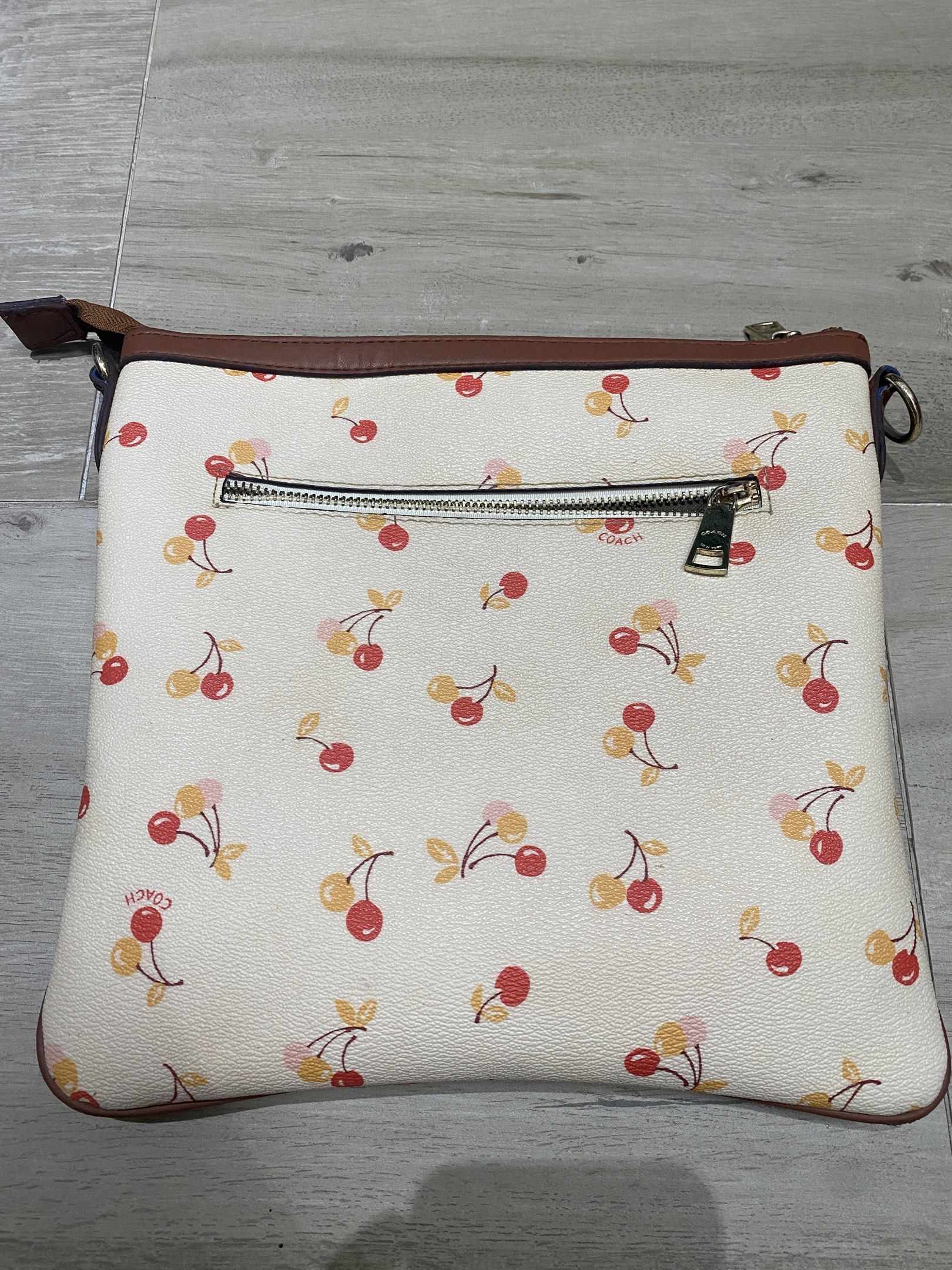 Coach Cherry Print Crossbody Bag (Category: Luxury Bags & Wallets) located in Quezon City. Submitted by itteliashp (Listing ID 1419127204, Image 3). Description: - Coach crossbody bag with cherry print .