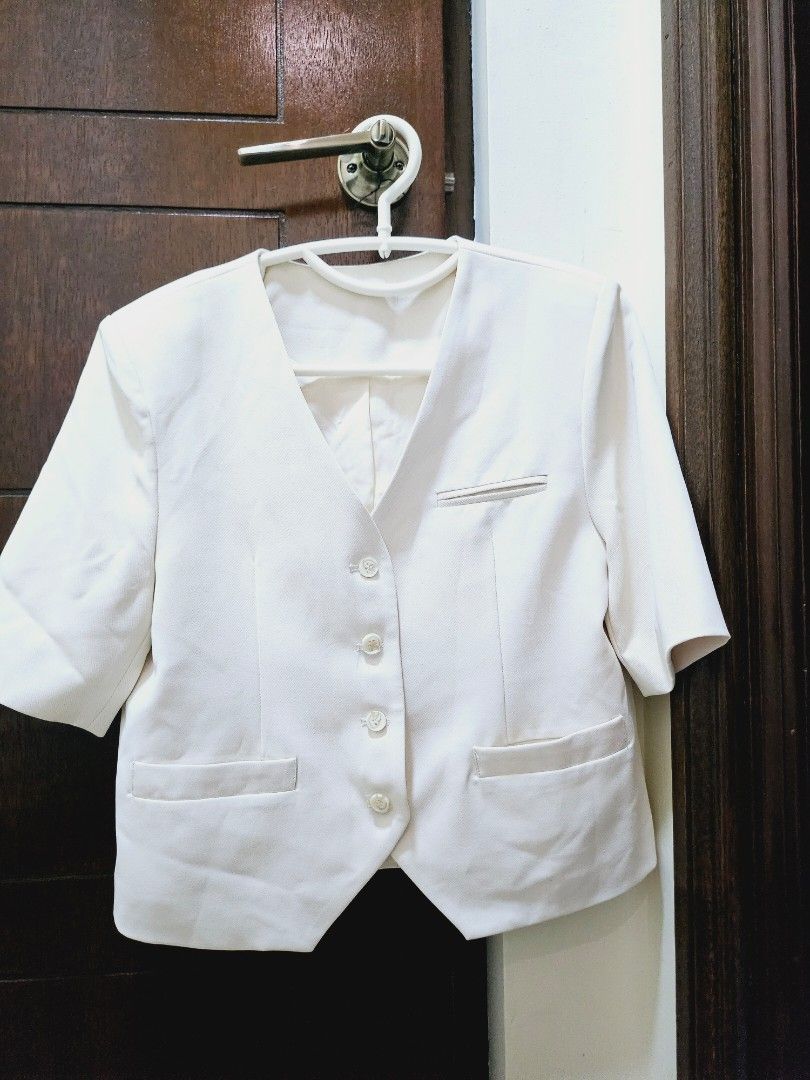 Cream Pleated Skirt Suit (Category: Skirts) located in Angeles City. Submitted by ssomma (Listing ID 1419111771, Image 1). Description: - Cream-colored skirt suit - Includes a jacket and a skirt - Jacket features: - Button-up closure - Pockets - Short sleeves - Skirt is pleated - Made of lightweight fabric.