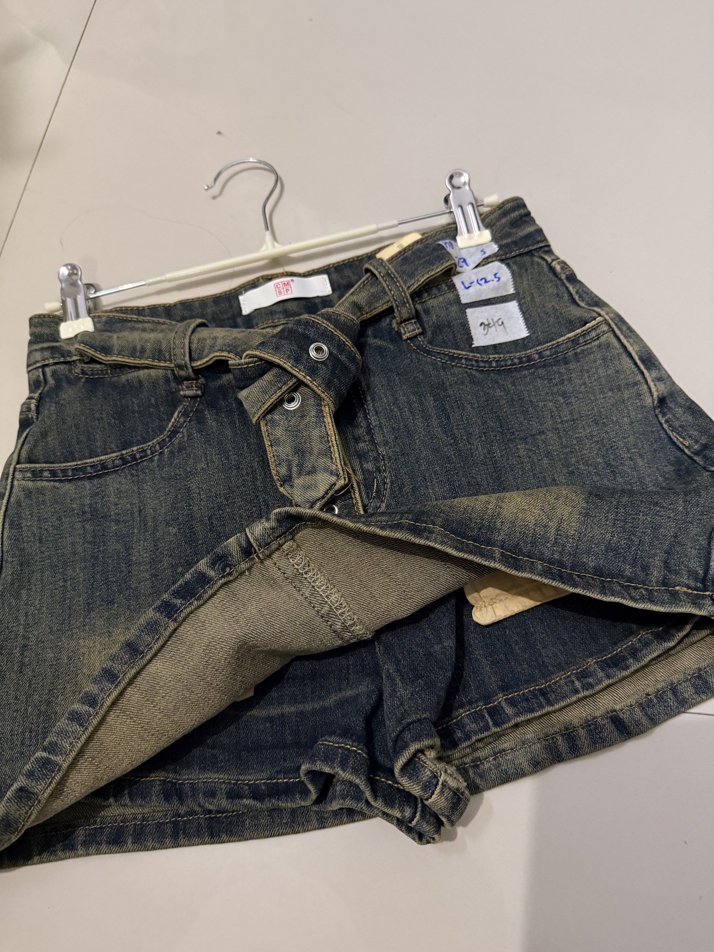 Denim Skirt with Belt (Category: Skirts) located in Baliuag. Submitted by lifewithkleng (Listing ID 1419157724, Image 3). Description: - Denim skirt with belt detail - Faded wash effect - Button closure - Two front pockets - Size: L (12.5) - Ideal for casual outfits.