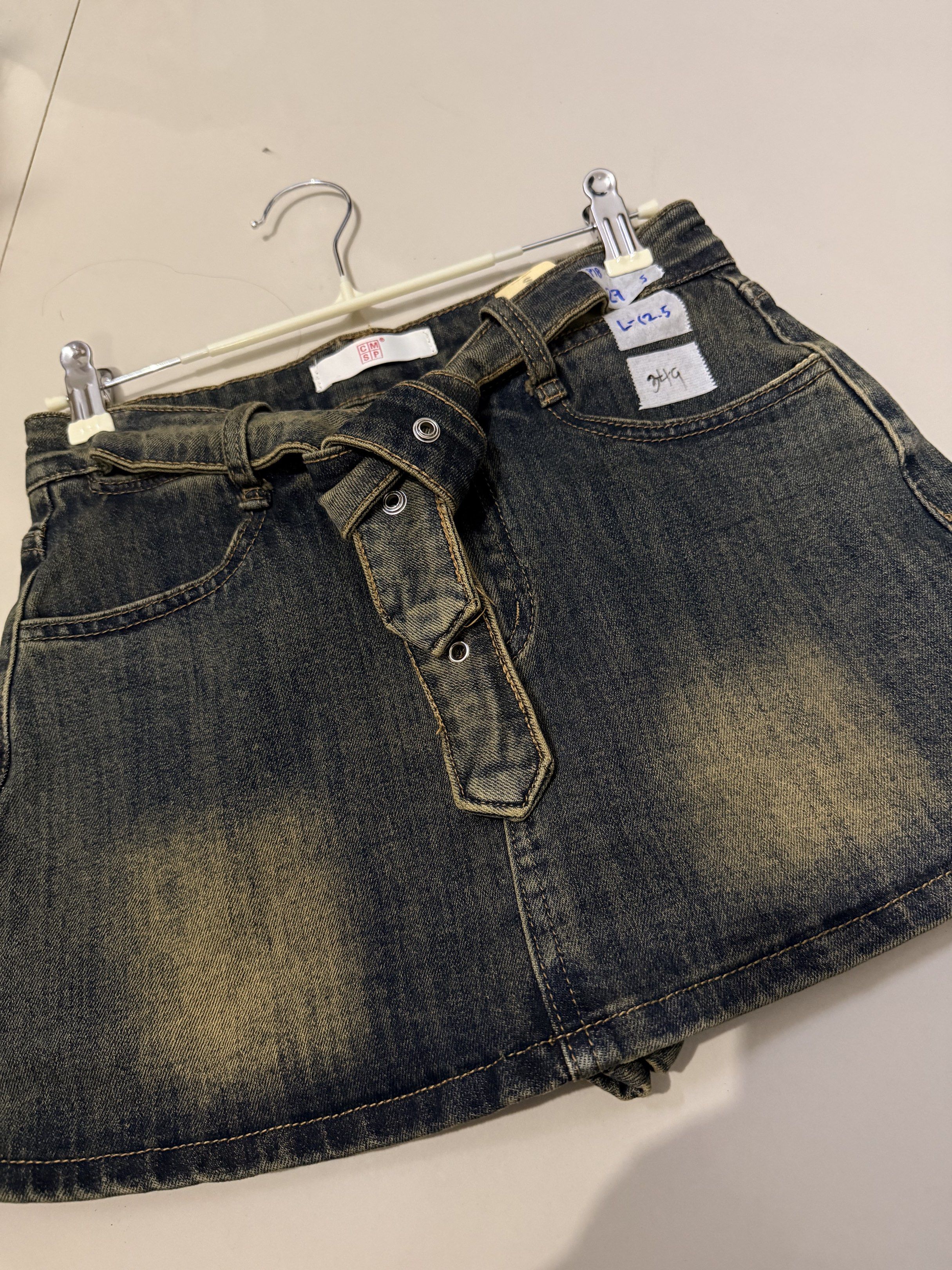 Denim Skirt with Belt (Category: Skirts) located in Baliuag. Submitted by lifewithkleng (Listing ID 1419157724, Image 2). Description: - Denim skirt with belt detail - Faded wash effect - Button closure - Two front pockets - Size: L (12.5) - Ideal for casual outfits.
