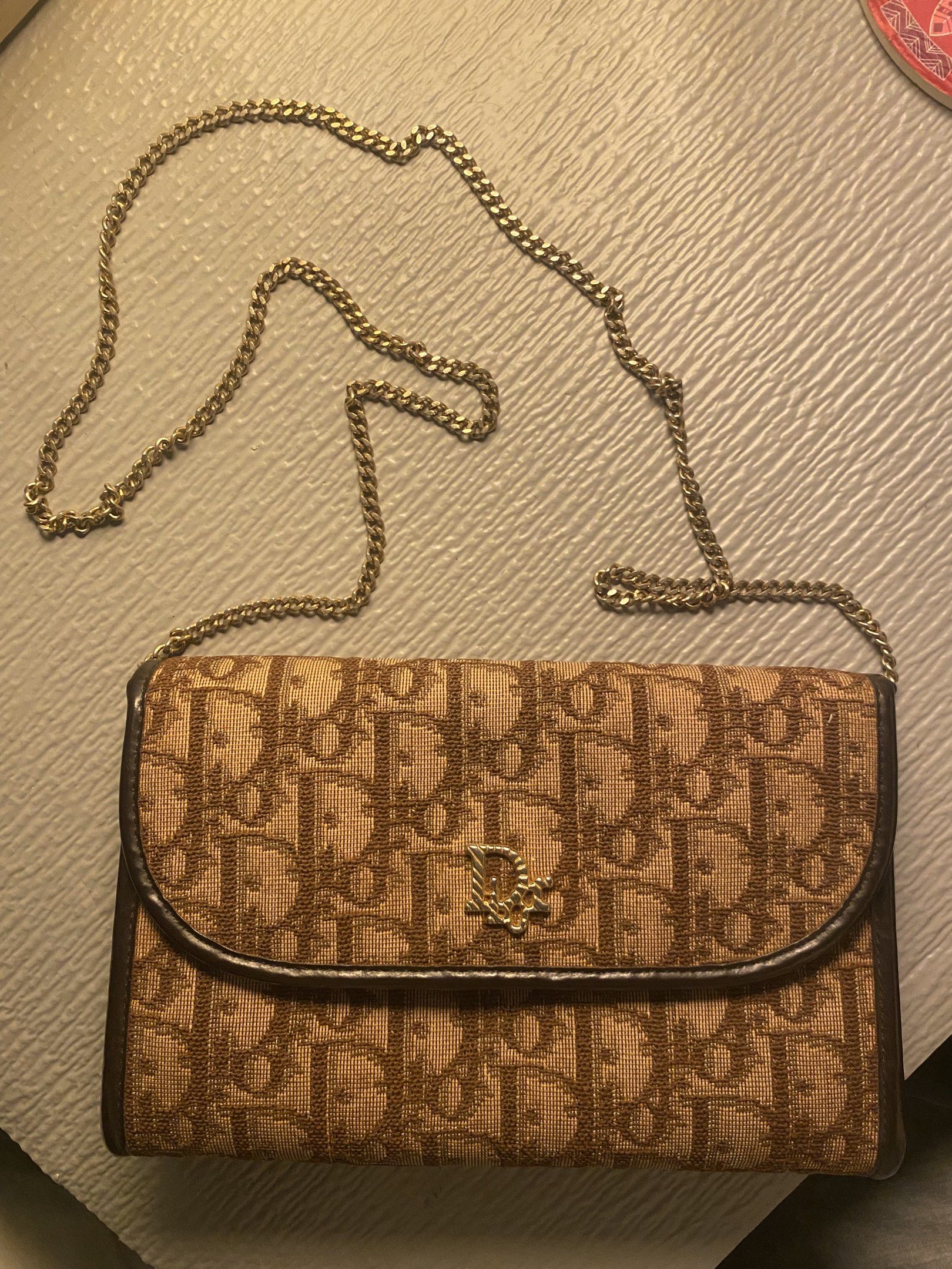 Dior Brown Oblique Canvas Bag (Category: Luxury Bags & Wallets) located in Quezon City. Submitted by preluvables (Listing ID 1419119127, Image 1). Description: 100% authentic & vintage. Negotiable Description - Authentic Dior shoulder bag - Brown oblique canvas - Gold chain strap - Brown leather interior - Magnetic snap closure -Just needs cleaning. but still in good condition. no bag or box - check last 2 photos for references -willing to do mee
