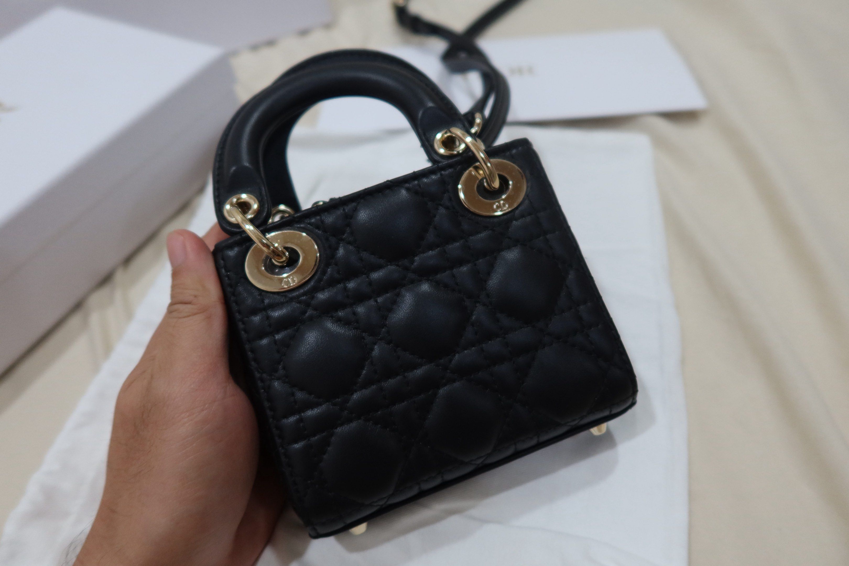 Dior Lady Dior Micro Bag Black (Category: Luxury Bags & Wallets) located in Cabuyao City. Submitted by allorigz (Listing ID 1419126772, Image 3). Description: - Authentic Lady Dior Micro Bag - Black color - Iconic Cannage stitching - Gold-tone hardware - Top handle - Detachable shoulder strap - Includes dust bag and box - Dior charm Complete with receipt Original price 245k.