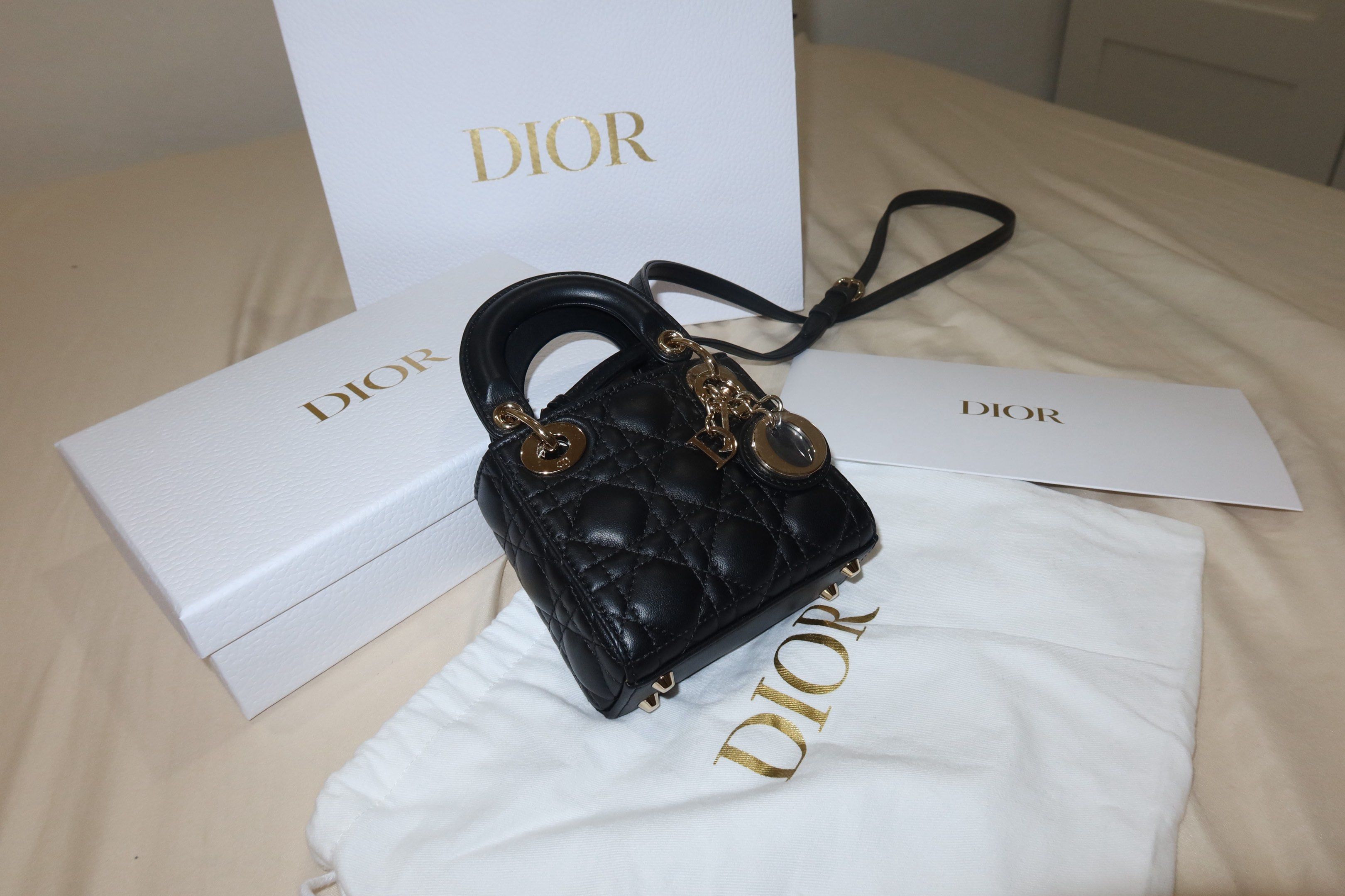 Dior Lady Dior Micro Bag Black (Category: Luxury Bags & Wallets) located in Cabuyao City. Submitted by allorigz (Listing ID 1419126772, Image 1). Description: - Authentic Lady Dior Micro Bag - Black color - Iconic Cannage stitching - Gold-tone hardware - Top handle - Detachable shoulder strap - Includes dust bag and box - Dior charm Complete with receipt Original price 245k.
