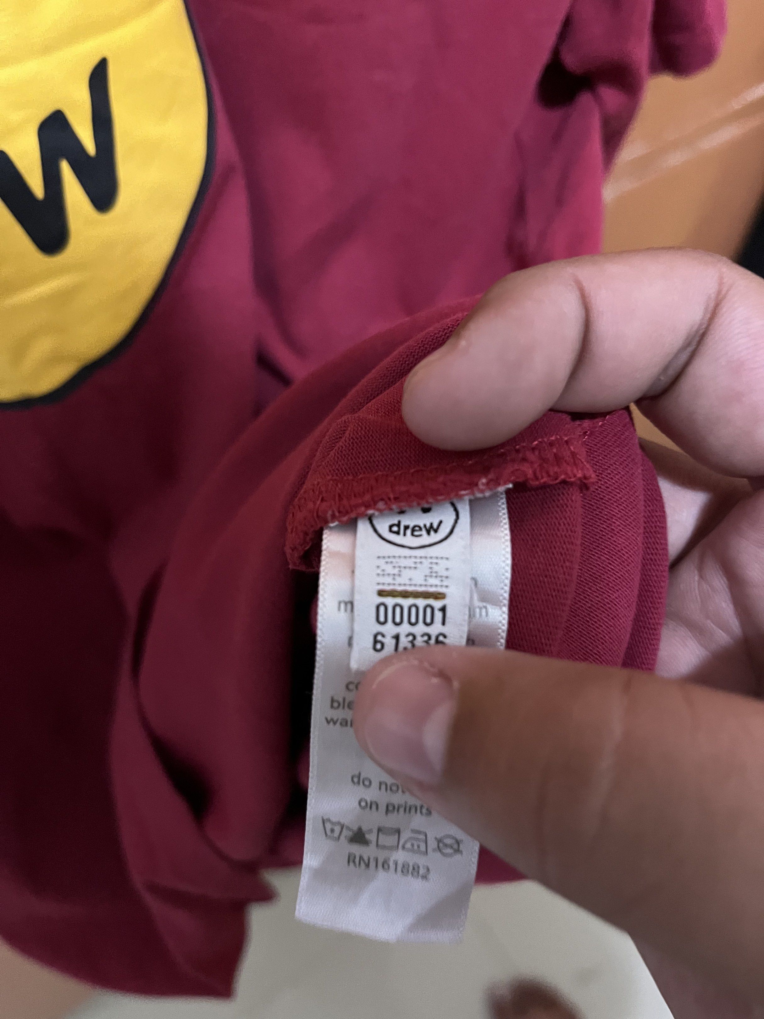 Drew House Smiley Face T-shirt (Category: Tshirts & Polo Shirts ) located in Batangas. Submitted by tregi (Listing ID 1419189753, Image 3). Description: - Drew House T-shirt - Deep maroon color - Features a large yellow smiley face - "drew" brand name printed below - Short sleeves - Crew neck 21/27.