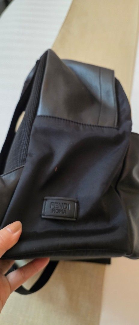 Fendi Eyes Backpack (Category: Luxury Bags & Wallets) located in Caloocan City. Submitted by mangoaddict18 (Listing ID 1419161057, Image 2). Description: - Black backpack with a unique eyes design. - Front zippered pocket for easy access. - Top handle for convenient carrying. - Interior zippered pocket for secure storage. - Adjustable straps for a comfortable fit. - Made from durable leather and nylon materials..