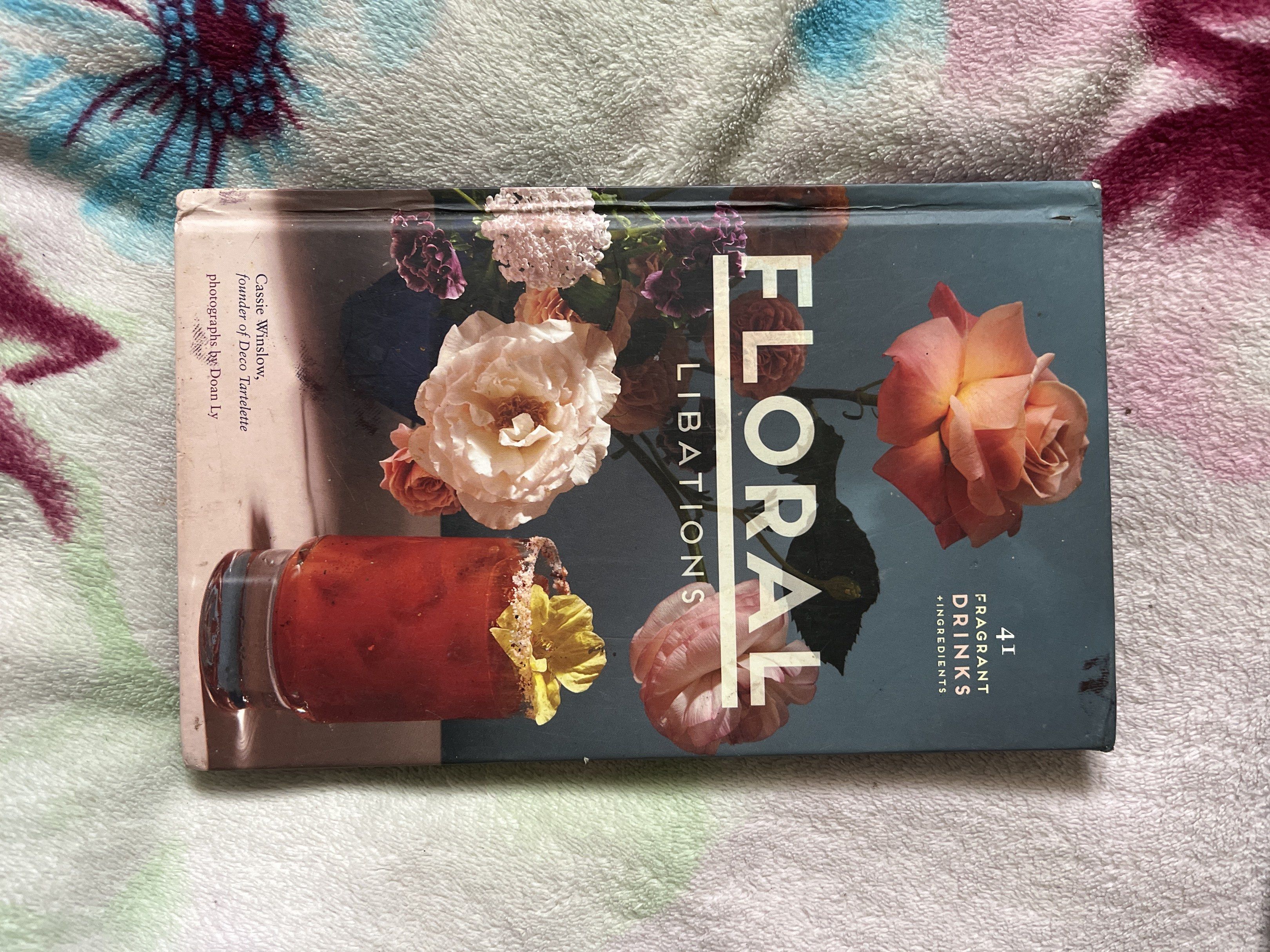 Floral Libations Cocktail Recipe Book (Category: Storybooks) located in Tarlac. Submitted by 444_conservative (Listing ID 1419020400, Image 1). Description: - "Floral Libations" features 41 fragrant drink recipes. - Includes recipes like the Hibiscus Tea Latte. - Beautifully illustrated with stunning floral photography. - Perfect for cocktail and floral arrangement lovers. - Step into the garden and take a sip!.