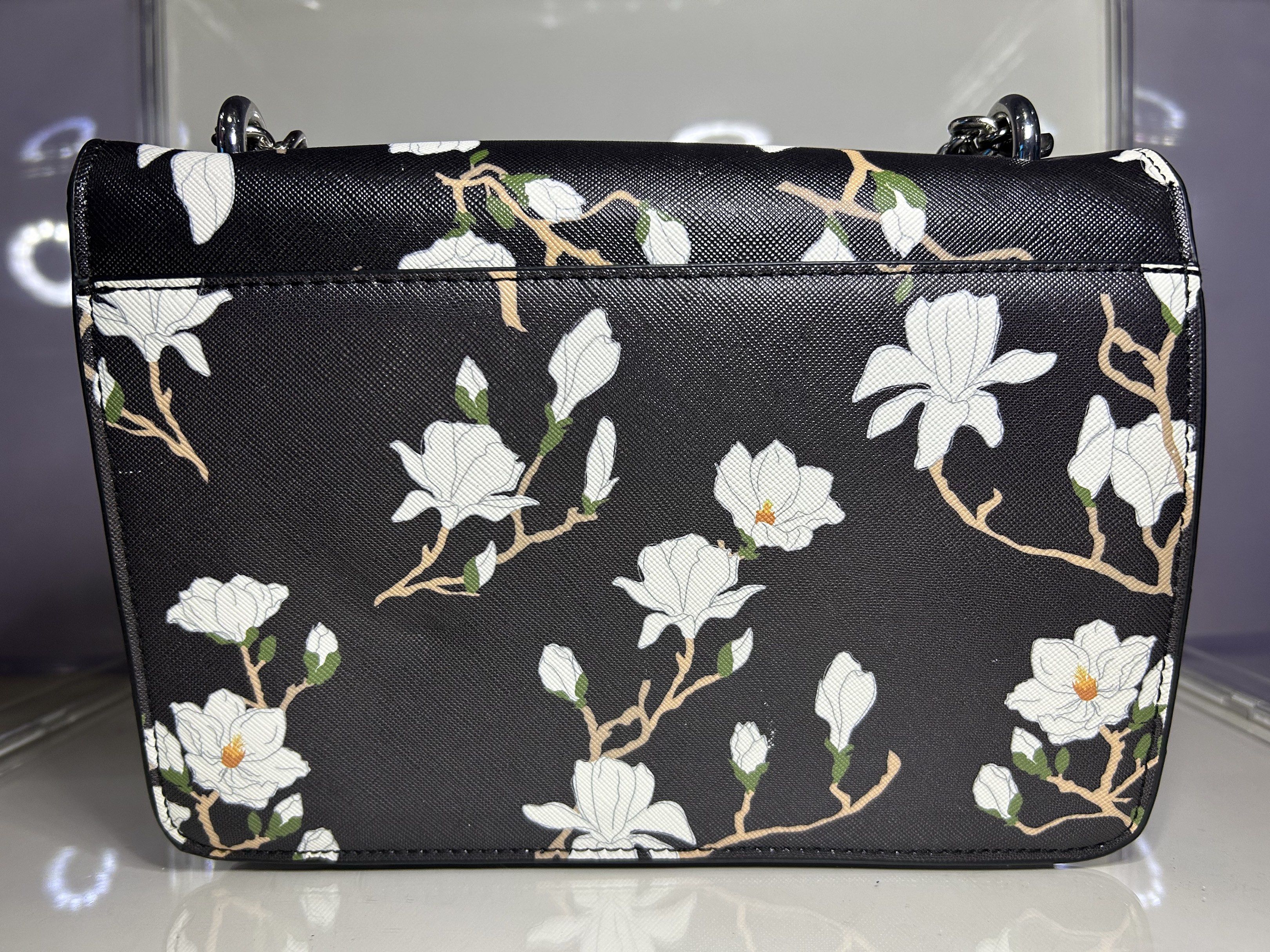 MANGO Chain Bag (Category: Luxury Bags & Wallets) located in Manila. Submitted by vaststar-be11 (Listing ID 1419113187, Image 3). Description: Full Model Name: MANGO Black & Pink Floral Print Sling - Floral print design - Chain strap - Magnetic closure - Black top, pink bottom - Black interior with small pocket - Perfect accessory.