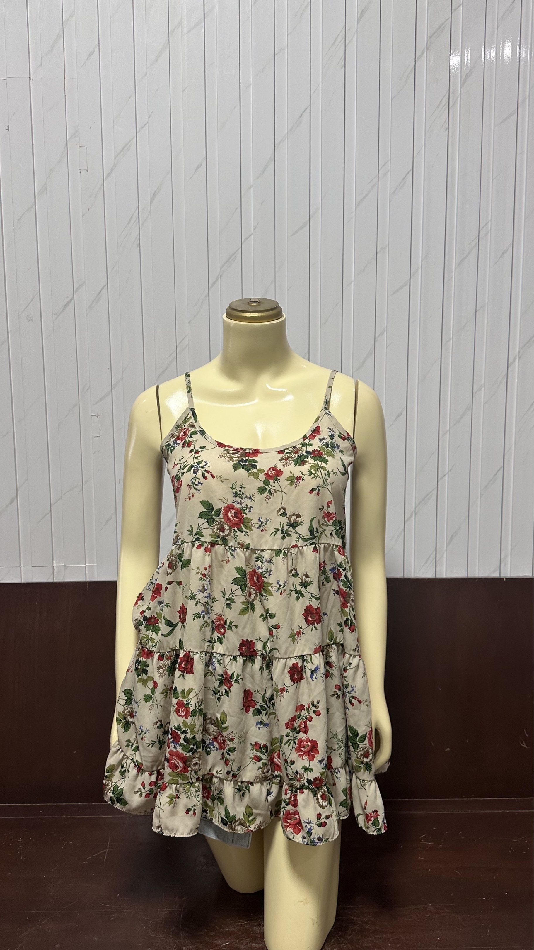 Floral Spaghetti Strap Dress (Category: Dresses) located in Taguig. Submitted by ylluhhhh (Listing ID 1419192165, Image 1). Description: - Floral print spaghetti strap dress - Tiered, ruffled hemline - Low back design - Light-colored fabric with red and green floral accents - Lightweight and ideal for warm weather.