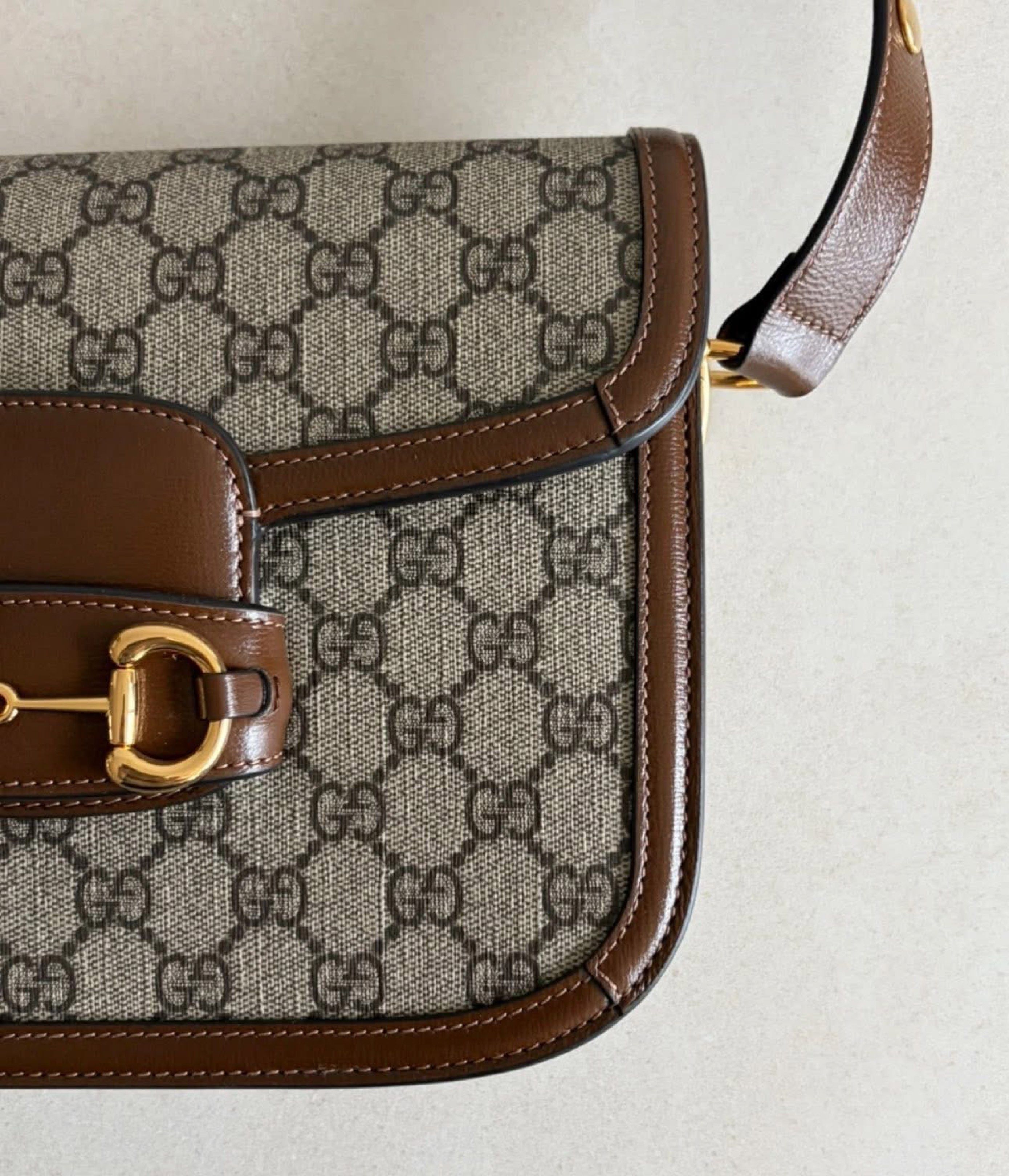 Gucci Horsebit 1955 Shoulder Bag (Category: Luxury Bags & Wallets) located in Quezon City. Submitted by curatedbyamethyst (Listing ID 1419000585, Image 3). Description: - Gucci Horsebit 1955 shoulder bag - GG Supreme canvas with brown leather trim - Gold-toned Horsebit detail - Adjustable shoulder strap - Spacious interior with zippered pocket - Light-colored fabric lining - Classic and elegant design.