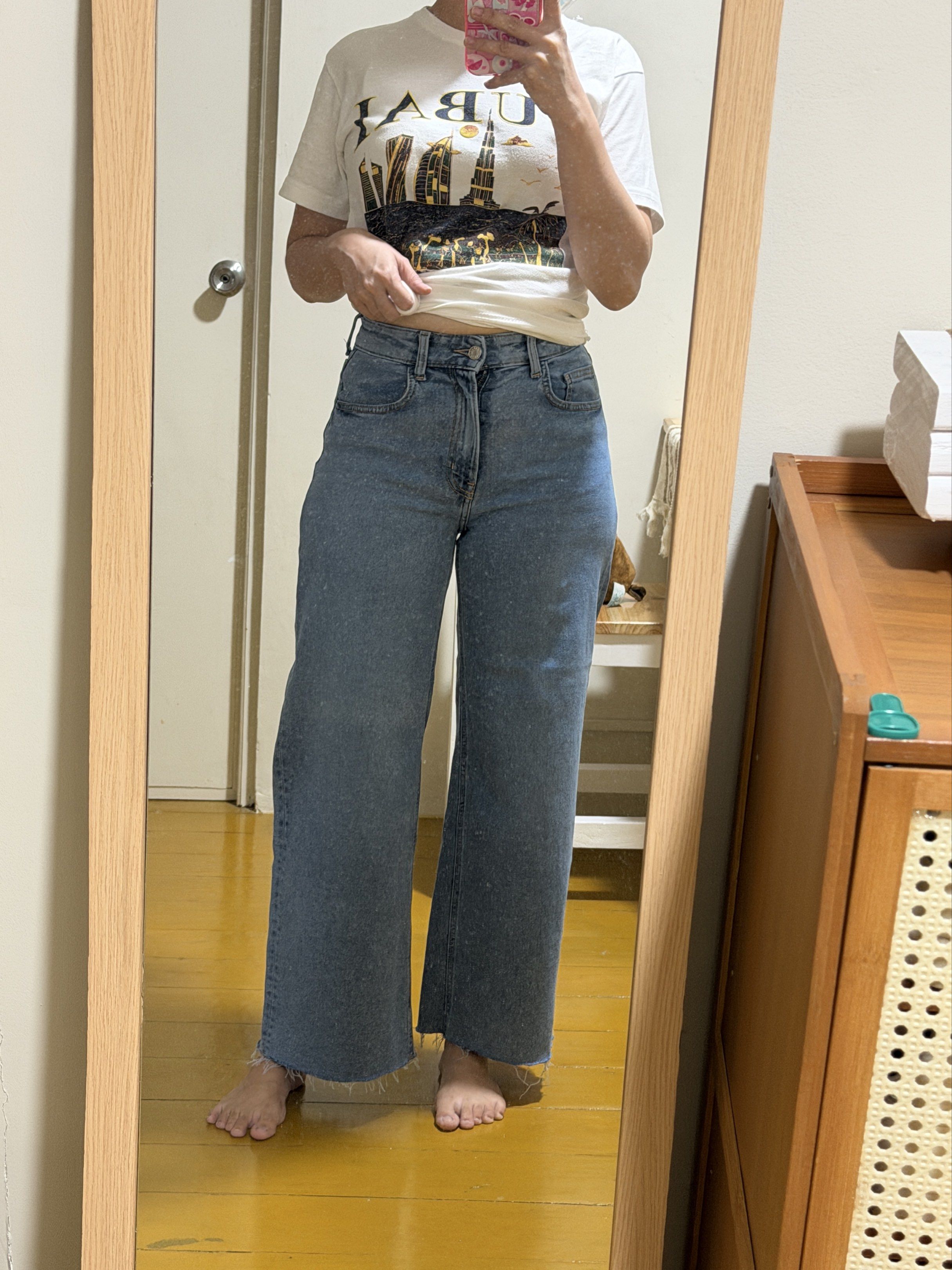 High-Waisted Wide Leg Jeans (Category: Jeans) located in Las Pinas. Submitted by __dayaaaaan21 (Listing ID 1419144287, Image 2). Description: - Light wash denim jeans - High-waisted, wide-leg cut - Classic five-pocket design - Button and zipper closure - Raw, unfinished hem - Medium wash denim - Ideal for casual outfits 27 Waistline.