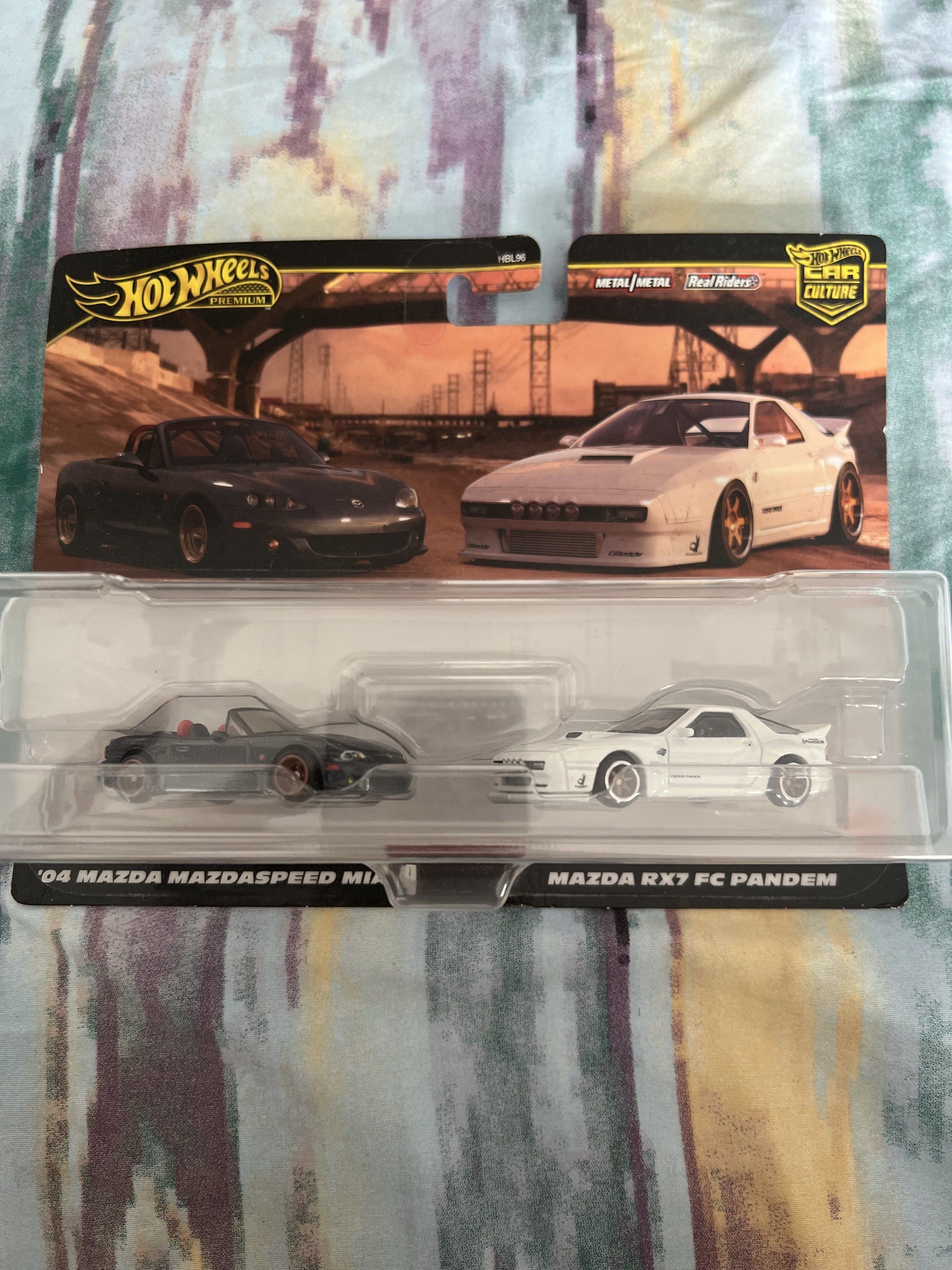 Hot Wheels Car Culture Mazda Set (Category: Vehicle & Diecast Models) located in Santo Domingo. Submitted by shutyourself0101211 (Listing ID 1419048650, Image 1). Description: Hot Wheels Car Culture set featuring a '04 Mazda Mazdaspeed Miata and a Mazda RX7 FC Pandem. Metal/metal Real Riders tires. Brand new in original packaging. Perfect for collectors!.