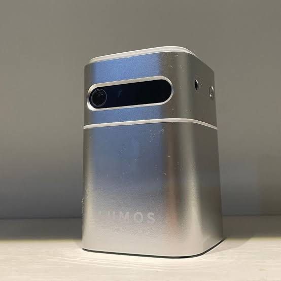 LUMOS Nano Projector (Category: Projectors) located in Manila. Submitted by willywonkawinner (Listing ID 1418992200, Image 1). Description: - Compact LUMOS projector - Multiple ports: HDMI and USB - Built-in apps: Netflix and YouTube - Includes remote control and power adapter - Silver finish - Built-in speaker - Tripod mountable - Top panel controls for volume and functions - Box / manual to follow as it’s in storage, gotten as a gift (You can g