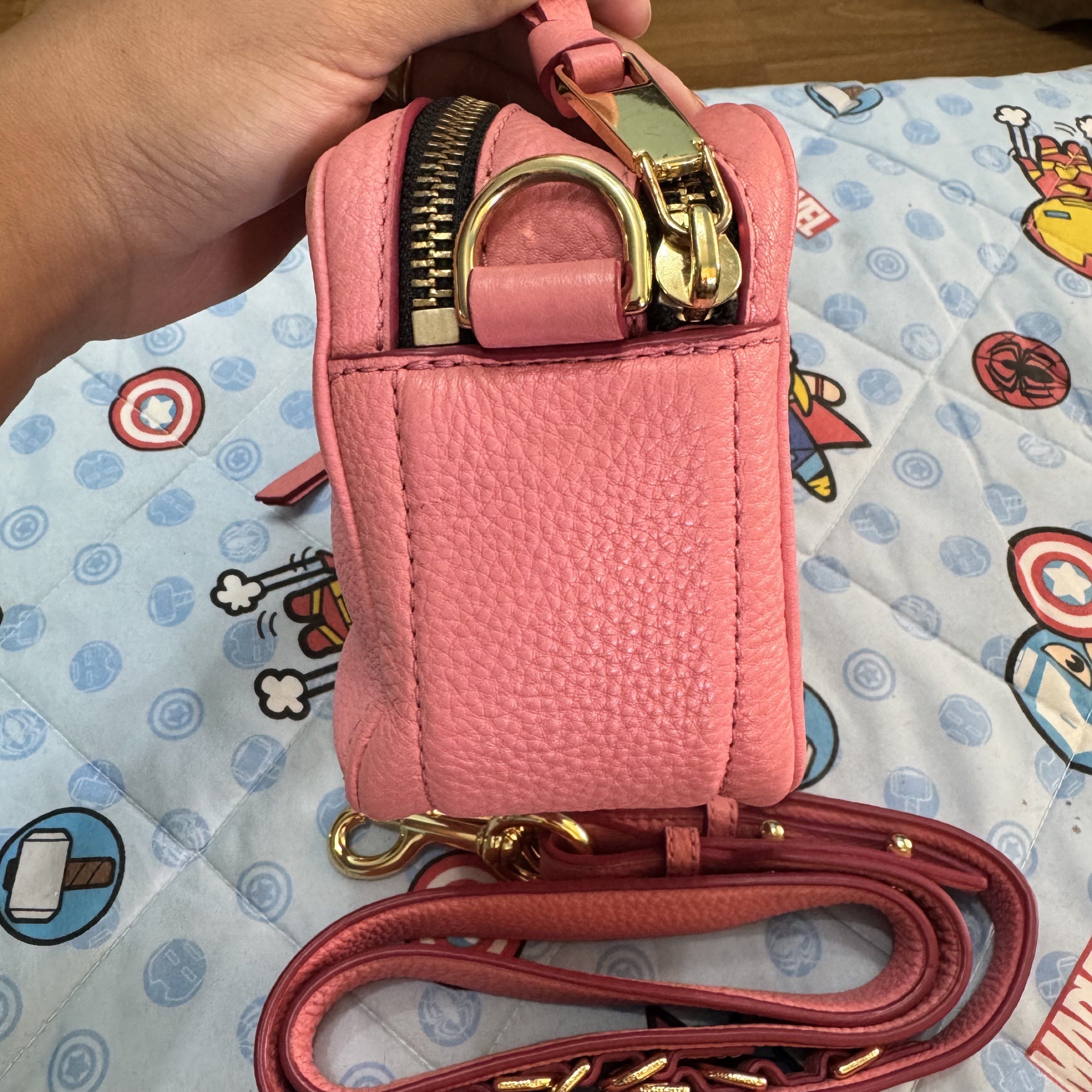 Marc Jacobs The Snapshot Crossbody Bag (Category: Luxury Bags & Wallets) located in Cabugao. Submitted by ydelle (Listing ID 1419001279, Image 3). Description: - Marc Jacobs Snapshot crossbody bag - Pink leather exterior - Gold-tone logo and hardware - Detachable and adjustable strap - Main compartment with card slot - Back pocket - Gold-toned zipper closure - Made in Vietnam.