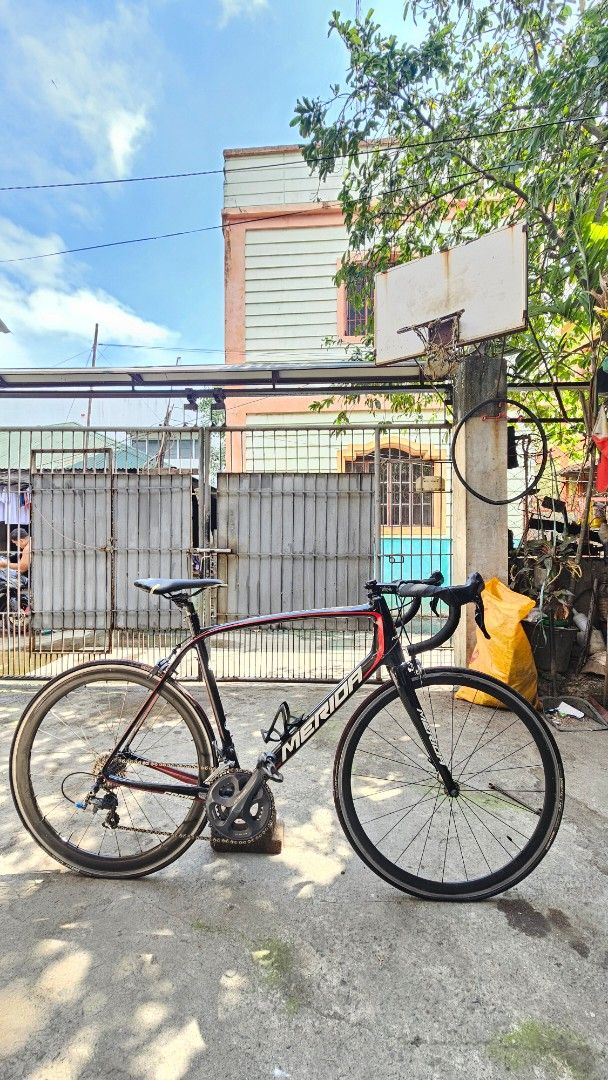 Merida Road Bike (Category: Bicycles) located in Bulacan. Submitted by jhazpenba63565 (Listing ID 1419007858, Image 1). Description: Whole bike is only 7.7kg Frameset: Merida Scultura 906 large size 52/50 BBR60 bottom bracket ✅️(fully bike skinned) ✅️UCI approved Cockpit: wake 80mm stem Deda SuperZero dropbar Fsa Carbon seatpost Groupset: (Ultegra 6700 straight) Crankset 6700 Sti lever 6700 Rd 6700 Fd 6700 Brake caliper 6700 Cogs: shimano ultegra