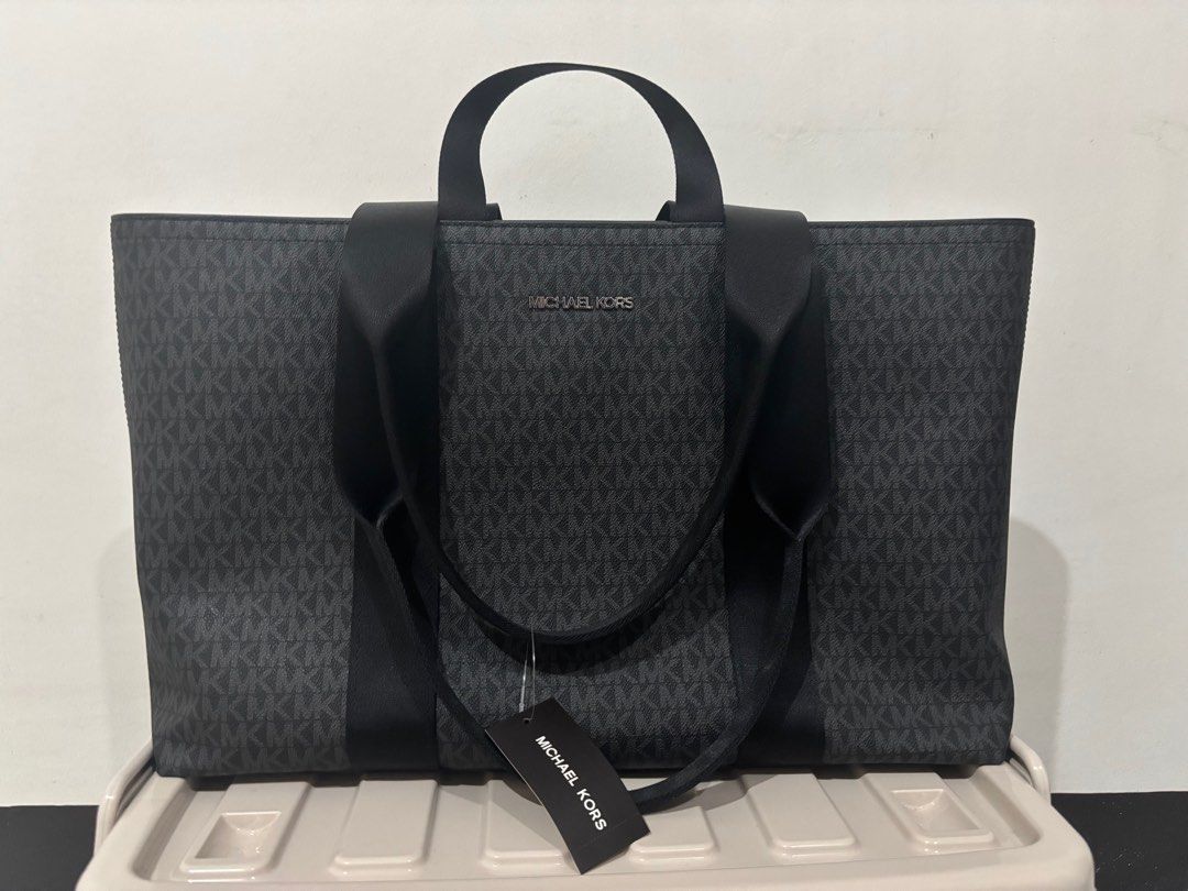 Michael Kors Tote Bag (Category: Luxury Bags & Wallets) located in Baler. Submitted by HelpDeclutterMyCloset (Listing ID 1419065298, Image 1). Description: - Michael Kors tote bag - Black and gray monogram pattern - Includes tag - Dual handles and shoulder strap - Ideal for everyday use or travel - Spacious interior - With zipper enclosure - Originally bought for USD 398 - OPEN for price negotiation - Brand New RFS: Need for funds ASAP.