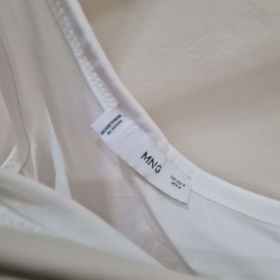 MNG White Top (Category: Sleeveless) located in Marikina City. Submitted by repurpose_studio (Listing ID 1419005303, Image 3). Description: - MNG white halter top - Made in Bangladesh - Solid white color - Size not specified.