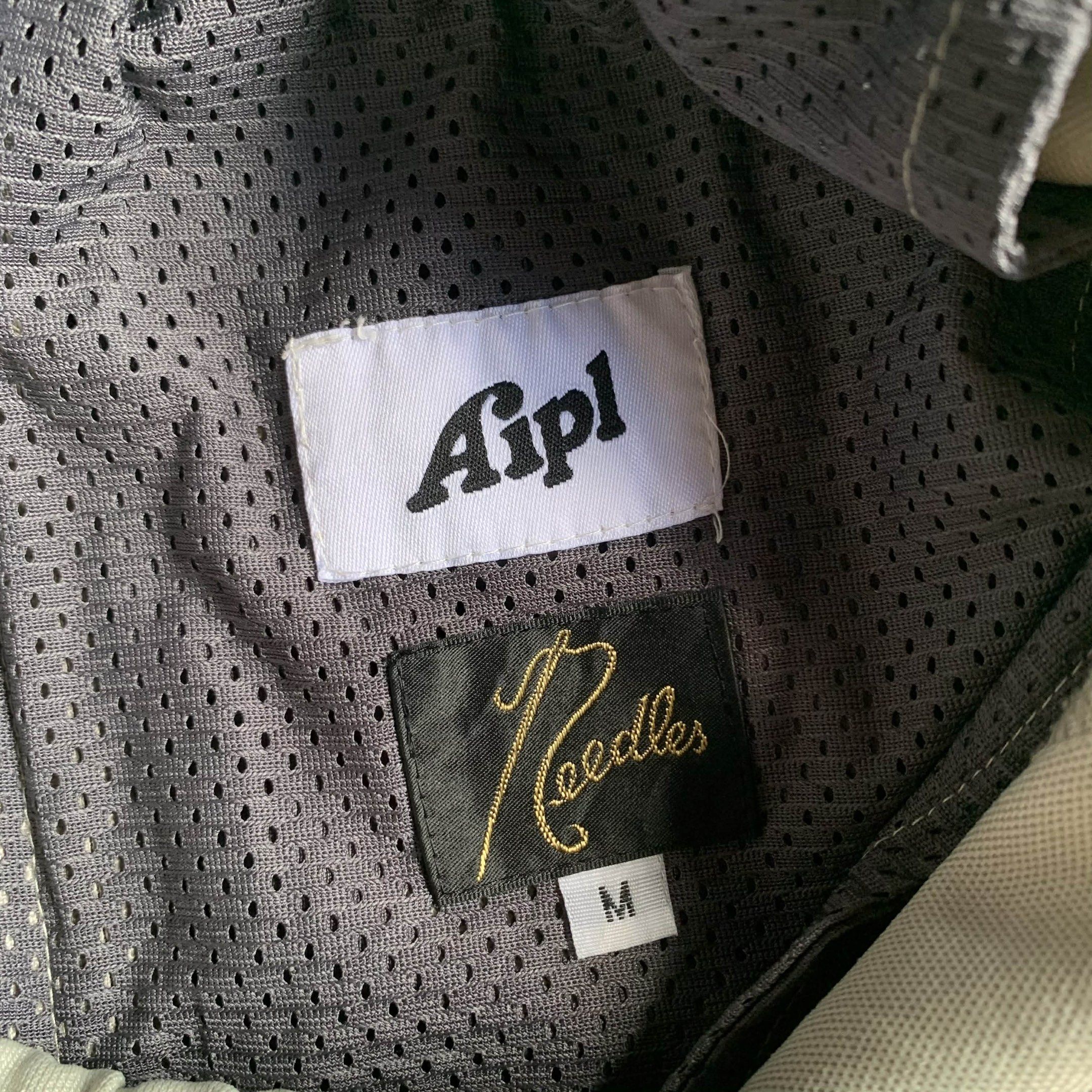 Needles x AIPL track pants (Category: Joggers) located in Baguio. Submitted by themgarbage (Listing ID 1419077896, Image 3). Description: waistline 33 thigh 11.5 length 48 leg opening 9.5 Size tagged: M.