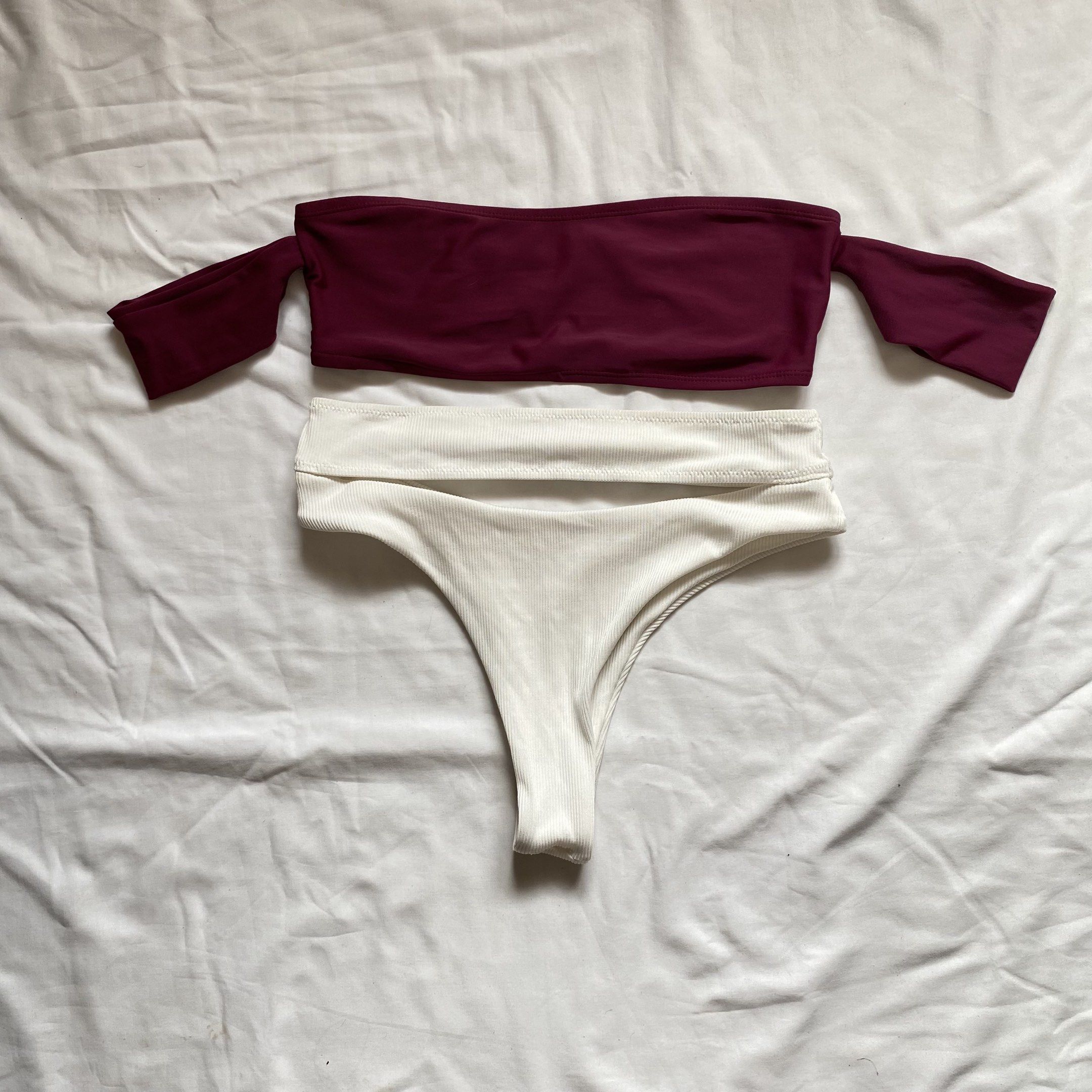 Off-Shoulder Bikini Set (Category: Bikinis & Swimsuits) located in San Mateo. Submitted by shop_moonchild.ph (Listing ID 1419106343, Image 1). Description: - Off-shoulder burgundy bikini top with sleeves - White high-waisted thong bottoms - Smooth, stretchy fabric.