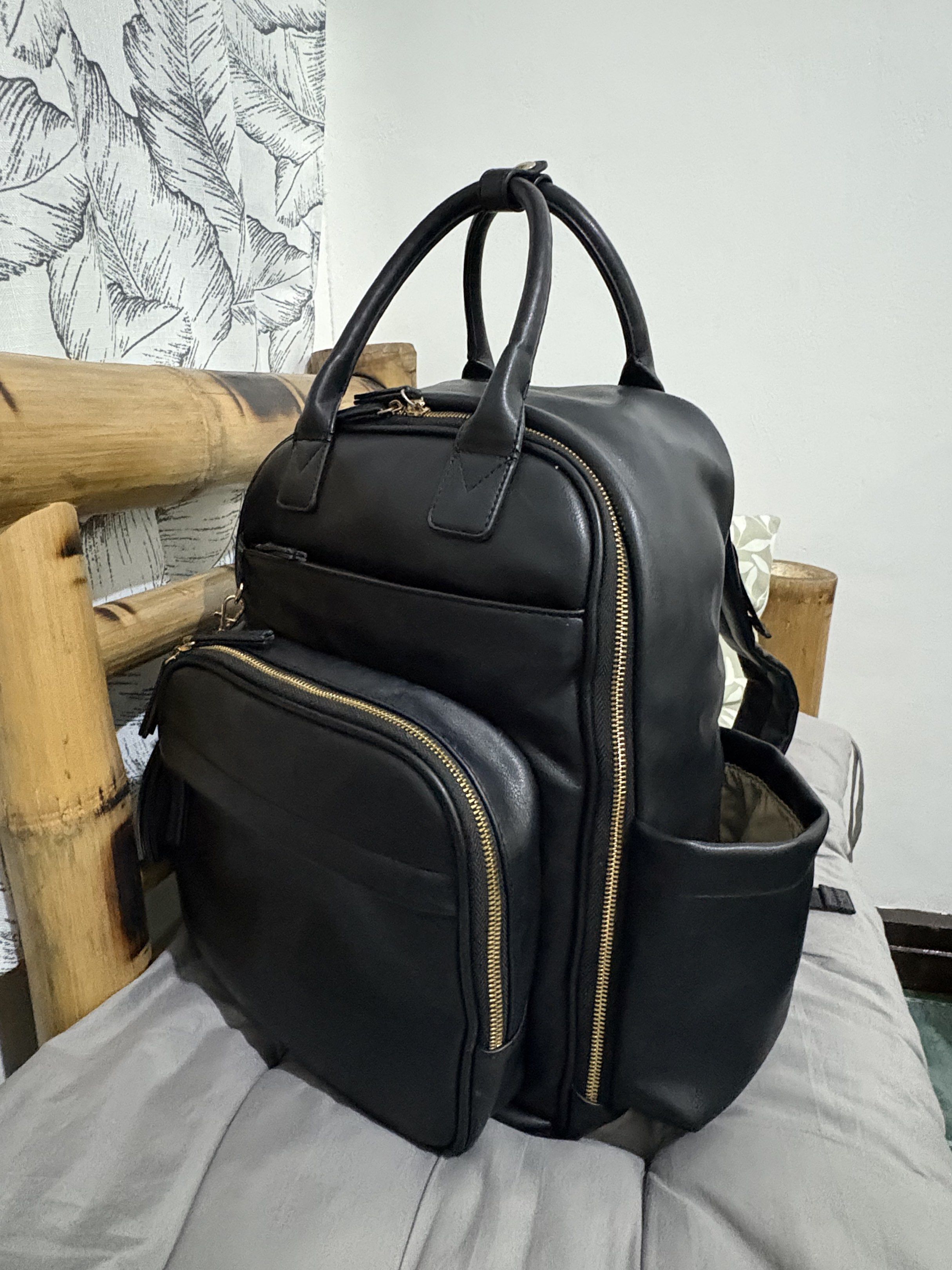 Omanmoli Black Faux Leather Diaper Backpack (Category: Diaper Bags & Wetbags) located in Mandaluyong City. Submitted by mommy_pril (Listing ID 1419100133, Image 2). Description: 🌷Omanmoli diaper backpack in excellent condition !! 🌷Changing pad is included 🌷Adjustable padded shoulder straps and stroller straps, with back pocket if you want to secure the bag on your luggage 🌷Makes 16 pockets in total, with 6 insulated pockets for baby bottles �