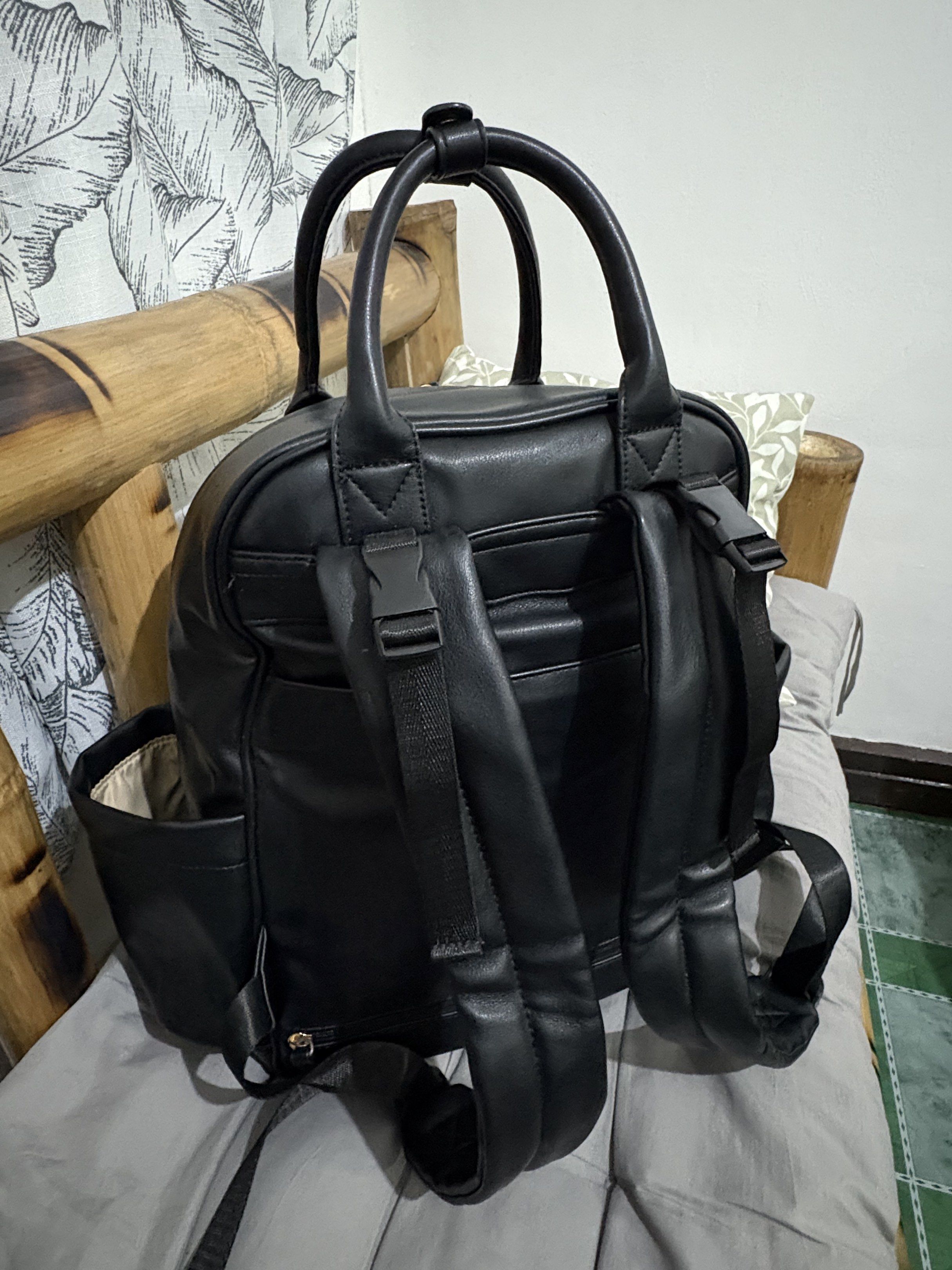 Omanmoli Black Faux Leather Diaper Backpack (Category: Diaper Bags & Wetbags) located in Mandaluyong City. Submitted by mommy_pril (Listing ID 1419100133, Image 3). Description: 🌷Omanmoli diaper backpack in excellent condition !! 🌷Changing pad is included 🌷Adjustable padded shoulder straps and stroller straps, with back pocket if you want to secure the bag on your luggage 🌷Makes 16 pockets in total, with 6 insulated pockets for baby bottles �
