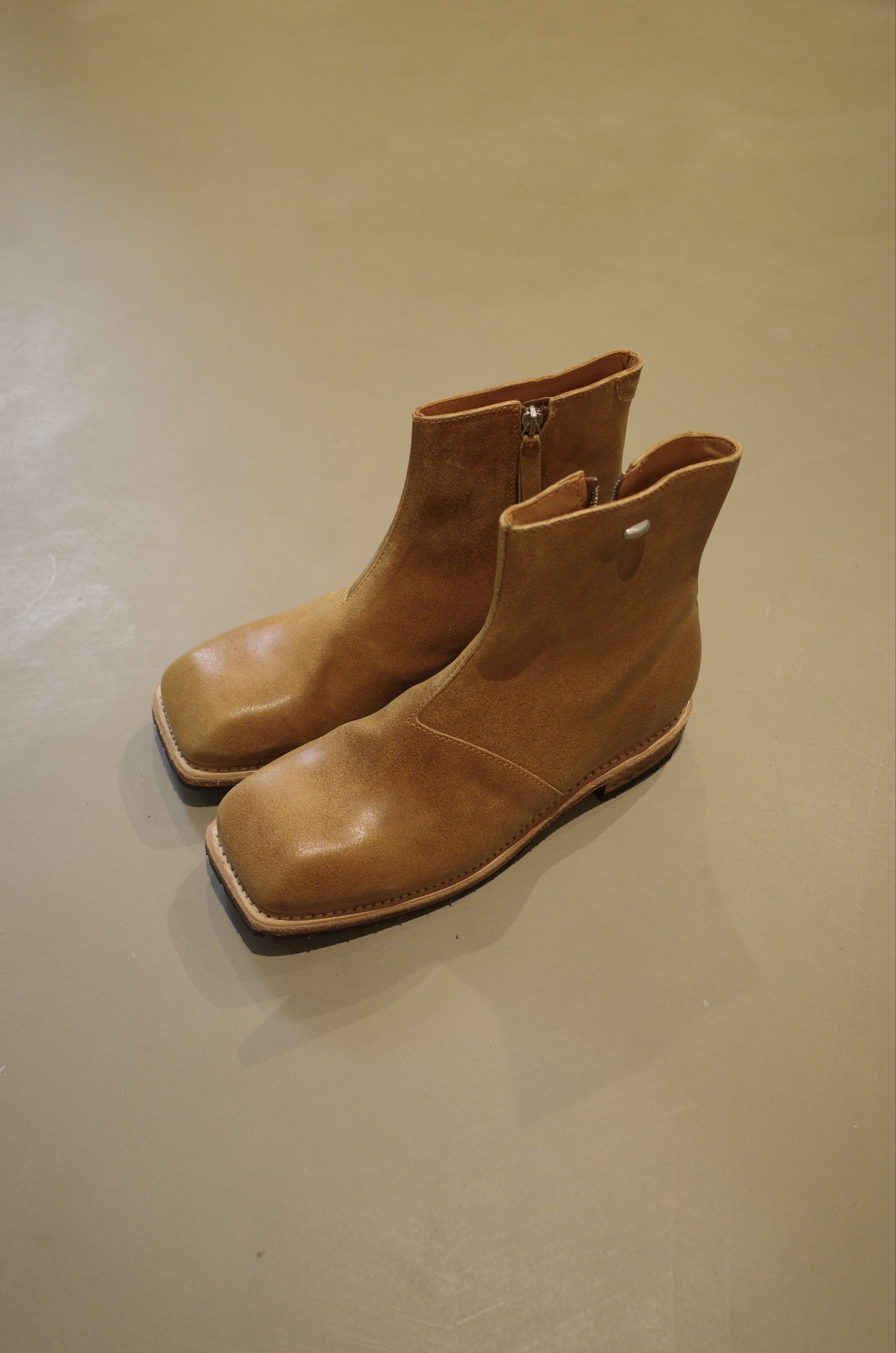Our Legacy Engine Boot (Sunset Sand Primal Suede) (Category: Boots) located in Pasig City. Submitted by rinse___repeat (Listing ID 1419074290, Image 1). Description: Our Legacy Engine Boot (Sunset Sand Primal Suede) Produced in a Spanish calf leather, the mid cut Engine Boot features a lugged Vibram sole, a Lampo side zip and a metal Our Legacy rivet. This product is crafted from carefully sourced leather. As a natural material, leather carries s