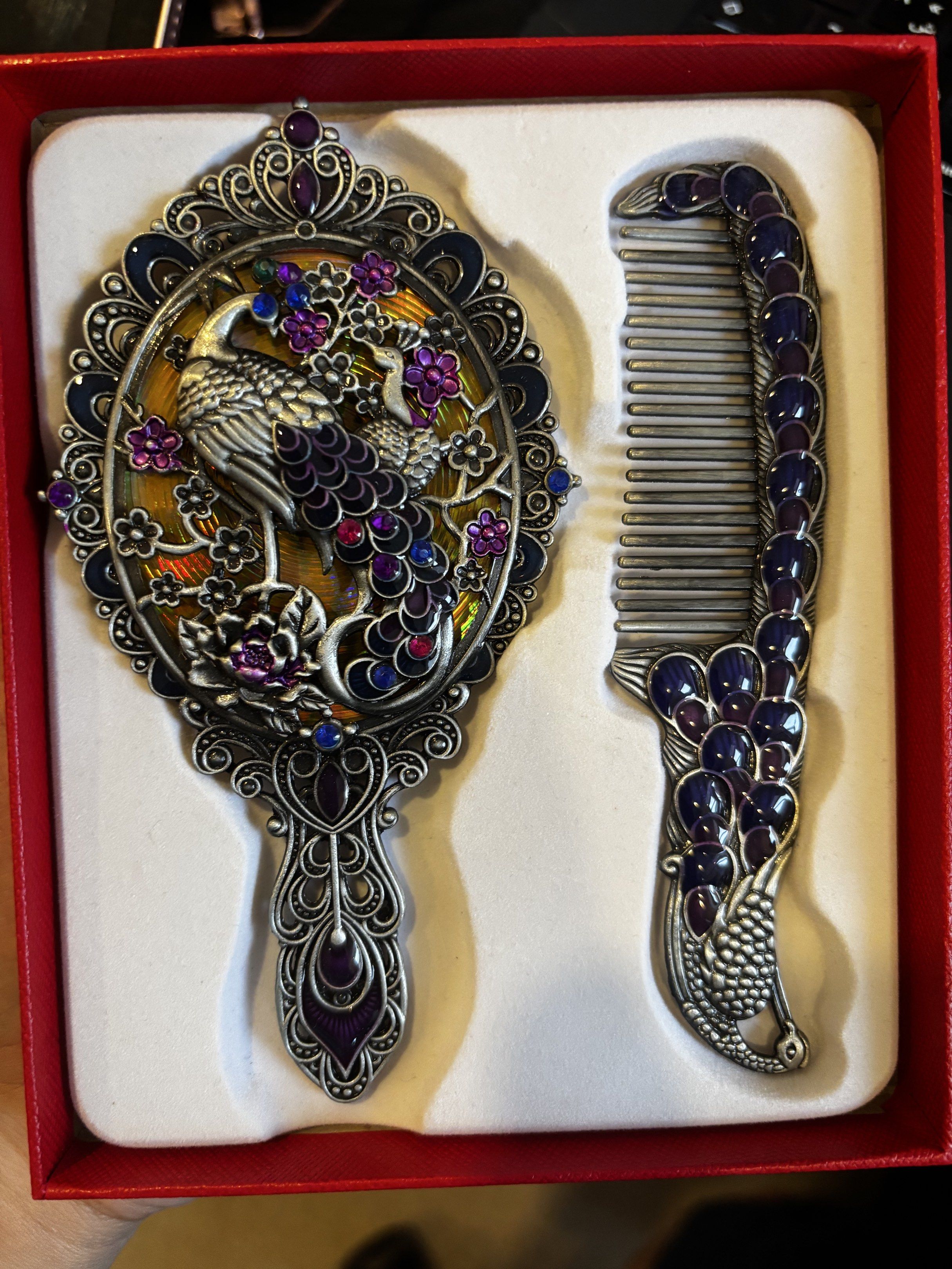 Peacock Design Mirror and Comb Set (Category: Mirrors) located in Manila. Submitted by koalexp38471 (Listing ID 1419013314, Image 1). Description: - Beautiful peacock design mirror and comb set. - Includes a hand mirror and matching comb. - Intricate details and colorful accents. - Mirror has a decorative frame and clear surface. - Comb has fine teeth for grooming. - Comes in a presentation box. - Ideal gift item. - From Jordan.