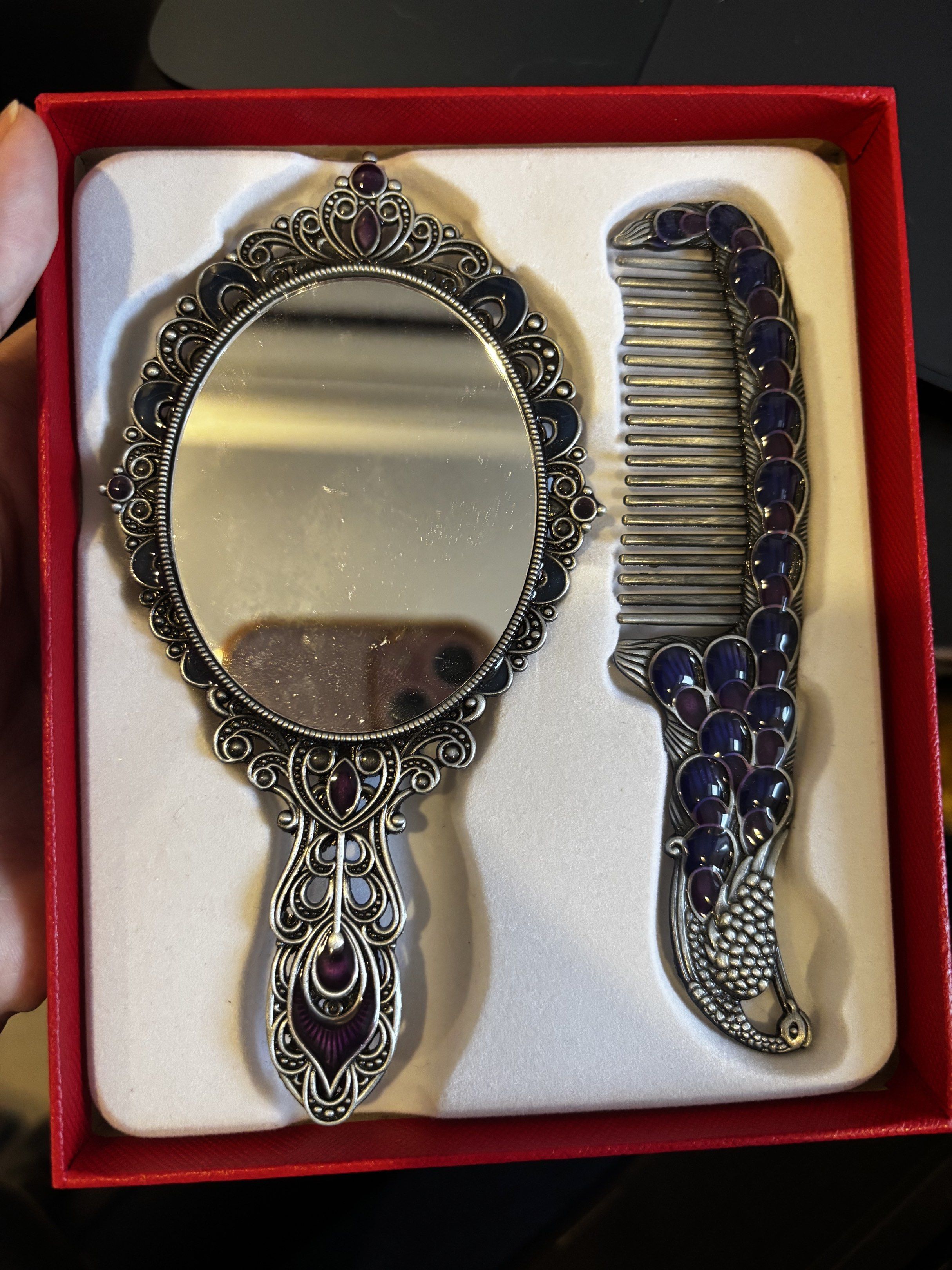 Peacock Design Mirror and Comb Set (Category: Mirrors) located in Manila. Submitted by koalexp38471 (Listing ID 1419013314, Image 2). Description: - Beautiful peacock design mirror and comb set. - Includes a hand mirror and matching comb. - Intricate details and colorful accents. - Mirror has a decorative frame and clear surface. - Comb has fine teeth for grooming. - Comes in a presentation box. - Ideal gift item. - From Jordan.