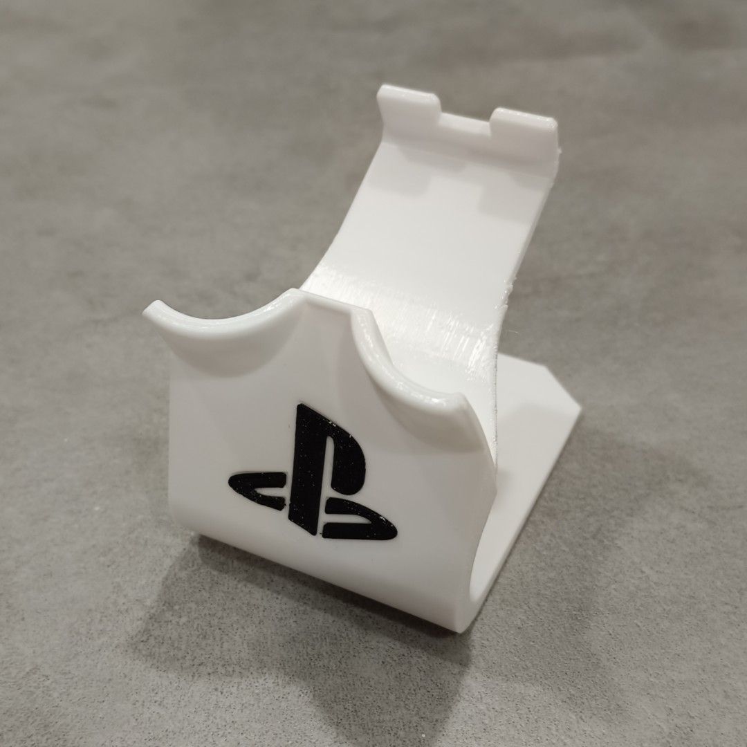 PS3 Controller Stand (Category: Controllers) located in Puchong. Submitted by elflied (Listing ID 1418991944, Image 2). Description: - PS3 controller stand (For 1 Controller) - Features PlayStation logo - Designed for PS2 & PS3 controllers - 3D printed Material - PetG - Securely holds controller - Keeps your controllers organized and displayed. - Controller not included*.