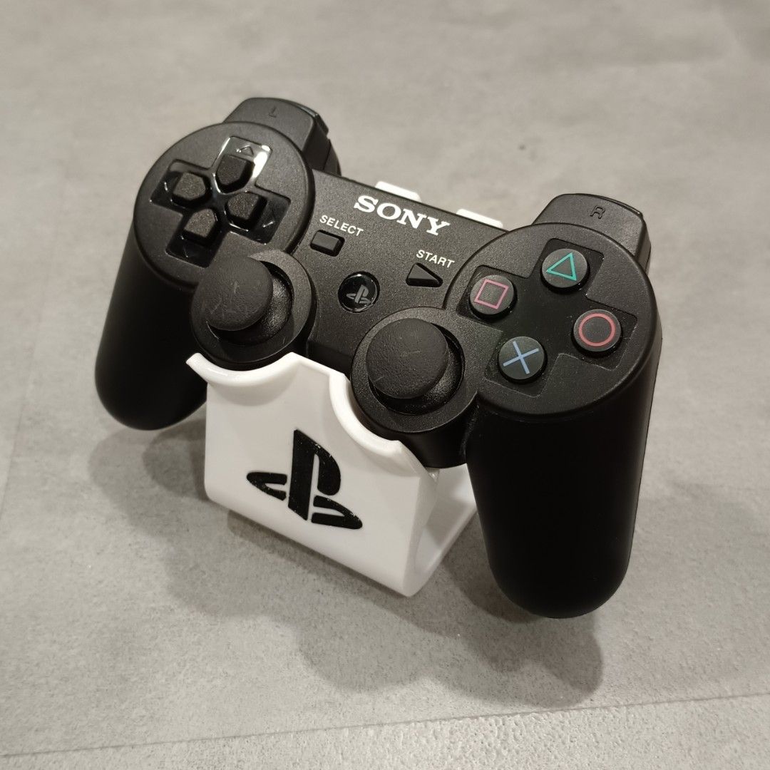 PS3 Controller Stand (Category: Controllers) located in Puchong. Submitted by elflied (Listing ID 1418991944, Image 1). Description: - PS3 controller stand (For 1 Controller) - Features PlayStation logo - Designed for PS2 & PS3 controllers - 3D printed Material - PetG - Securely holds controller - Keeps your controllers organized and displayed. - Controller not included*.