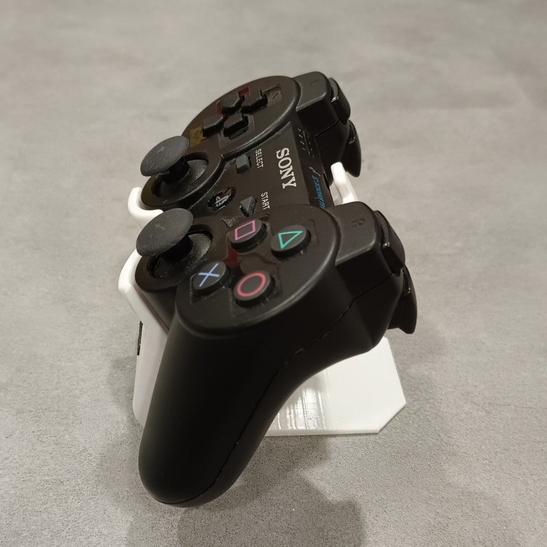 PS3 Controller Stand (Category: Controllers) located in Puchong. Submitted by elflied (Listing ID 1418991944, Image 3). Description: - PS3 controller stand (For 1 Controller) - Features PlayStation logo - Designed for PS2 & PS3 controllers - 3D printed Material - PetG - Securely holds controller - Keeps your controllers organized and displayed. - Controller not included*.