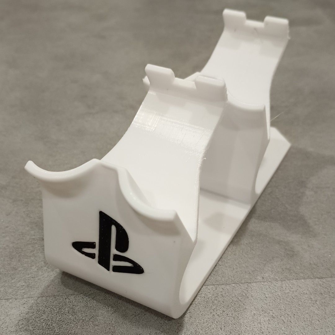PS3 Controller Stand (Category: Controllers) located in Puchong. Submitted by elflied (Listing ID 1418992346, Image 2). Description: - PS3 controller stand (For 2 Controllers) - Features PlayStation logo - Designed for PS2 & PS3 controllers - 3D printed Material - PetG - Securely holds controller - Keeps your controllers organized and displayed. - Controller not included*.