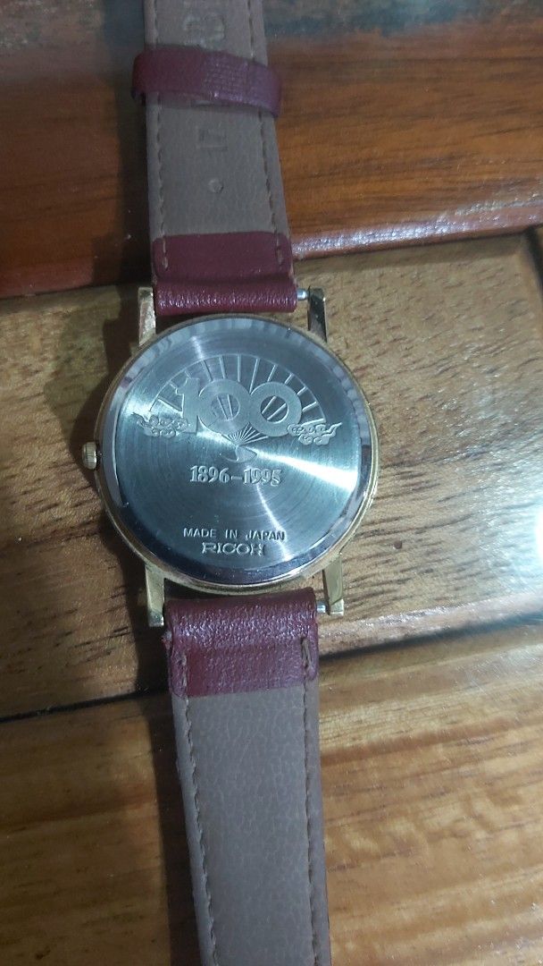 Ricoh Misonoza 100th Anniversary Watch (Category: Luxury Watches) located in Naga. Submitted by kenshin78 (Listing ID 1419150570, Image 3). Description: -Ricoh Misonoza 100th anniversary watch - Black dial with gold-tone hands - Gold-tone case - Burgundy leather strap - Minimalist design with single dot at 12 o'clock - Made in Japan - Perfect for everyday wear.