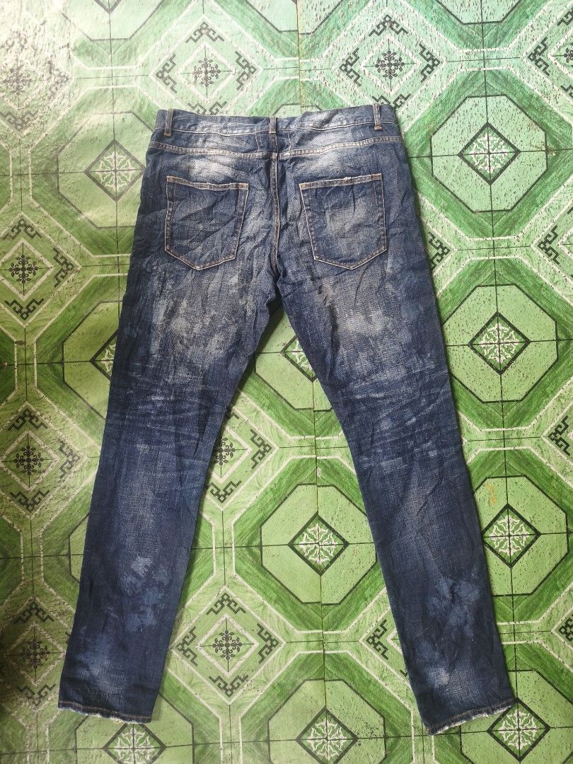 Saint Laurent D02 M/SL-LW Jeans (Category: Jeans) located in Lingayen. Submitted by c7quiter84444 (Listing ID 1419000214, Image 2). Description: - Saint Laurent jeans - Size 32 - Classic blue wash - Slim fit - Button closure with Saint Laurent logo - Made in Japan - Distressed look with faded areas - Unique detailing - Simple back pocket design - Orange stitching.