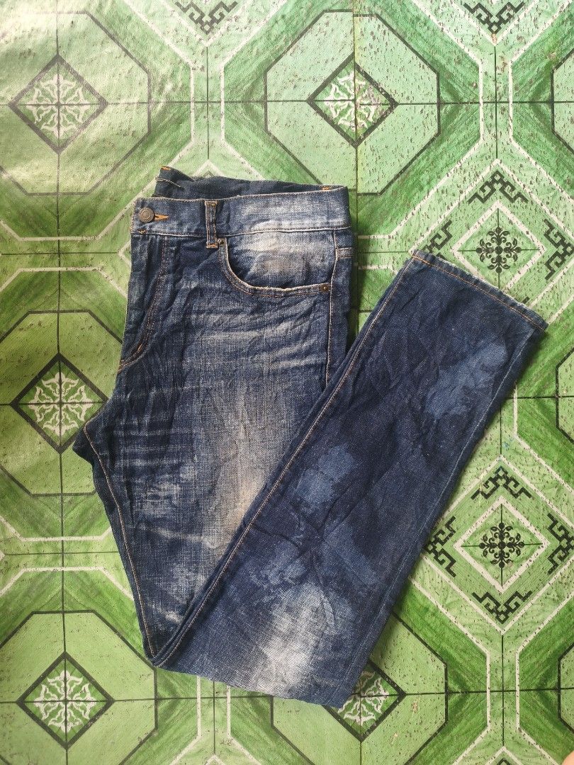 Saint Laurent D02 M/SL-LW Jeans (Category: Jeans) located in Lingayen. Submitted by c7quiter84444 (Listing ID 1419000214, Image 3). Description: - Saint Laurent jeans - Size 32 - Classic blue wash - Slim fit - Button closure with Saint Laurent logo - Made in Japan - Distressed look with faded areas - Unique detailing - Simple back pocket design - Orange stitching.