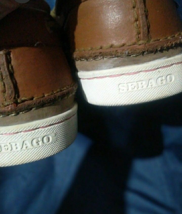 Sebago Boat Shoes (Category: Casual Shoes) located in Naga. Submitted by pec3c (Listing ID 1419086315, Image 2). Description: - Sebago boat shoes in brown leather - White soles with Sebago logo - Red soles - Leather laces - Metal eyelets - Sebago logo visible on the side - Well-maintained condition.