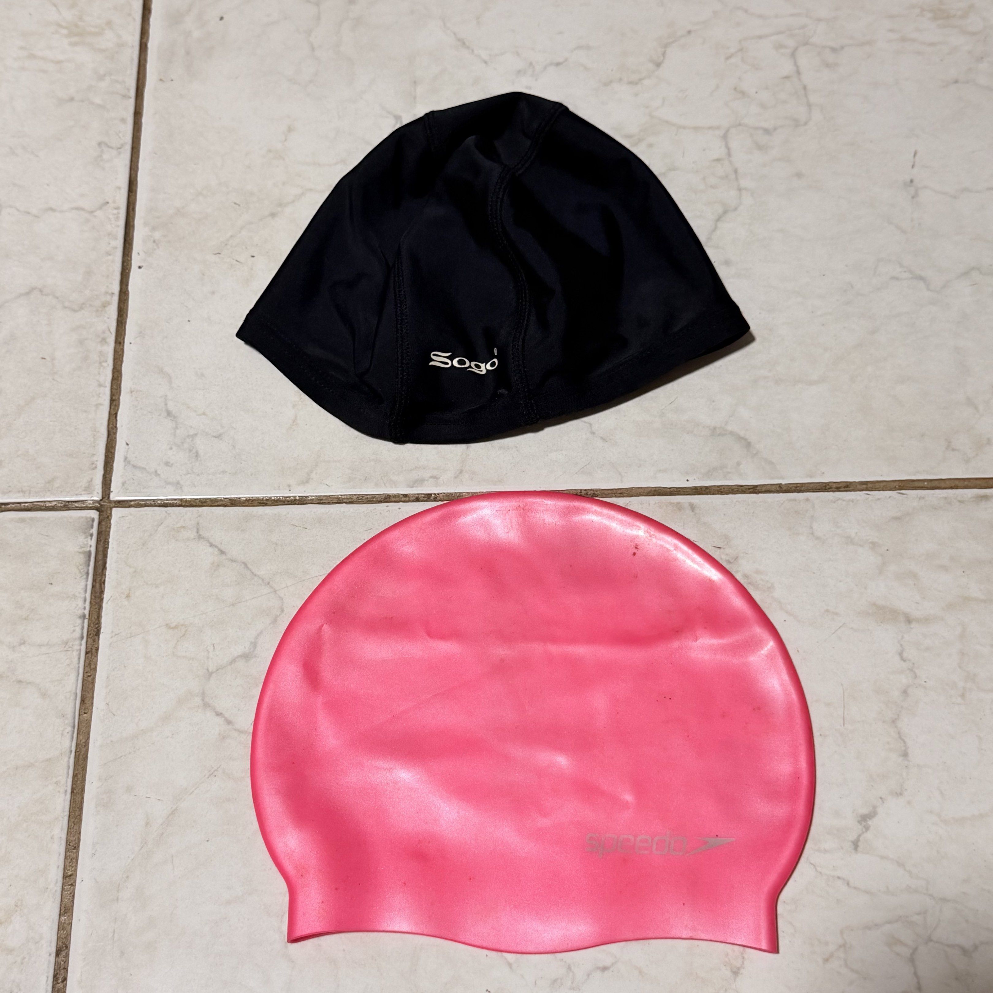 Sogo and Speedo Swimming Caps (Category: Bikinis & Swimsuits) located in Pasig City. Submitted by decluttertrends (Listing ID 1418999328, Image 1). Description: 200 take all - Available: Black Sogo swimming cap and pink Speedo swimming cap. - Features: - Suitable for swimming and water activities. - Pink cap: Silicone material. .