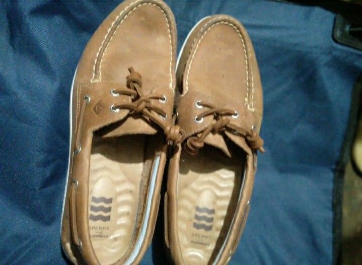 Sperry Top-Sider Boat Shoes (Category: Casual Shoes) located in Naga. Submitted by pec3c (Listing ID 1419087950, Image 1). Description: - Classic Sperry Top-Sider boat shoes - Brown leather - Features Sperry Plushwave technology for added comfort - Lace-up design with metal eyelets - White soles with Sperry Top-Sider branding - Insole with Sperry logo and wave pattern - Stylish and comfortable for casual wear.