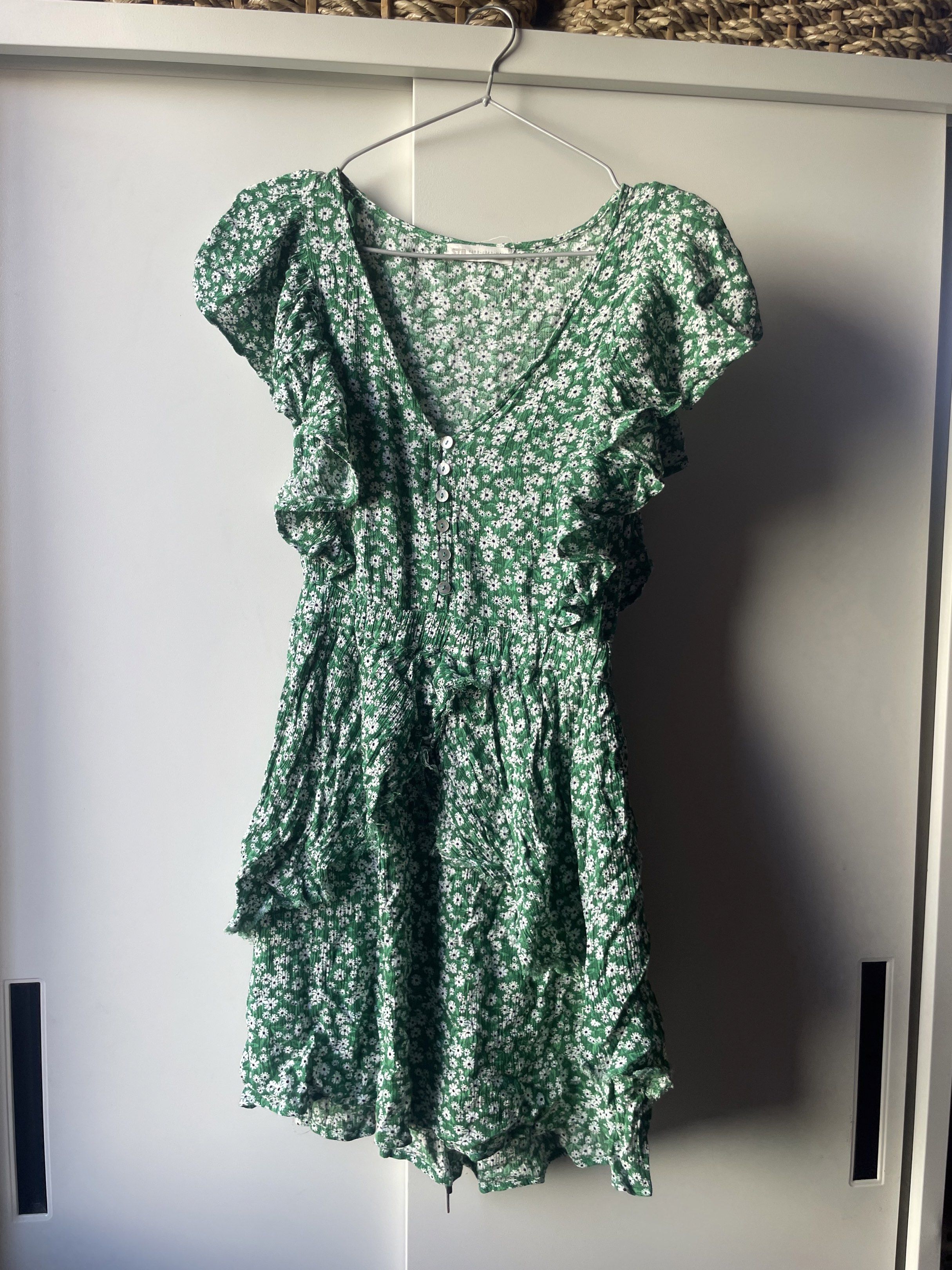 STR Floral Mini Dress (Category: Dresses) located in Manila. Submitted by chenpots (Listing ID 1419058598, Image 1). Description: - Brand: STR - Size: S - Style: Mini dress - Features: - Green with floral pattern - V-neck - Ruffled sleeves - Button-down front - Gathered waist - Tiered skirt.
