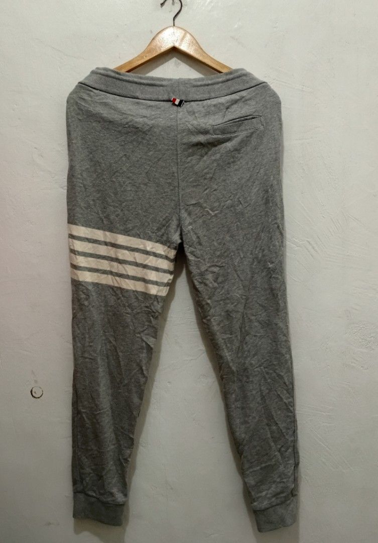Thom Browne CLASSIC loopback 4bar trackpants (Category: Luxury Apparel) located in Manila. Submitted by eriiicaspage (Listing ID 1419159323, Image 3). Description: PreOwned Lightly Used Authentic THOM BROWNE. Classic loopback 4bar trackpamts -Size 1 fits MENS -SMALL -MEDIUM WOMENS -LARGE -XL - White stripes on left leg - Drawstring waist - Small patch detail - Soft material - Small detail on back waistband Made in Japan Min Sign of Used flaws : N