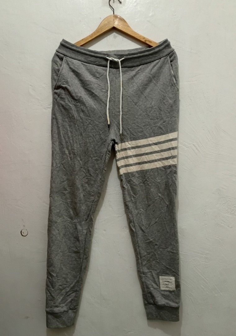 Thom Browne CLASSIC loopback 4bar trackpants (Category: Luxury Apparel) located in Manila. Submitted by eriiicaspage (Listing ID 1419159323, Image 2). Description: PreOwned Lightly Used Authentic THOM BROWNE. Classic loopback 4bar trackpamts -Size 1 fits MENS -SMALL -MEDIUM WOMENS -LARGE -XL - White stripes on left leg - Drawstring waist - Small patch detail - Soft material - Small detail on back waistband Made in Japan Min Sign of Used flaws : N