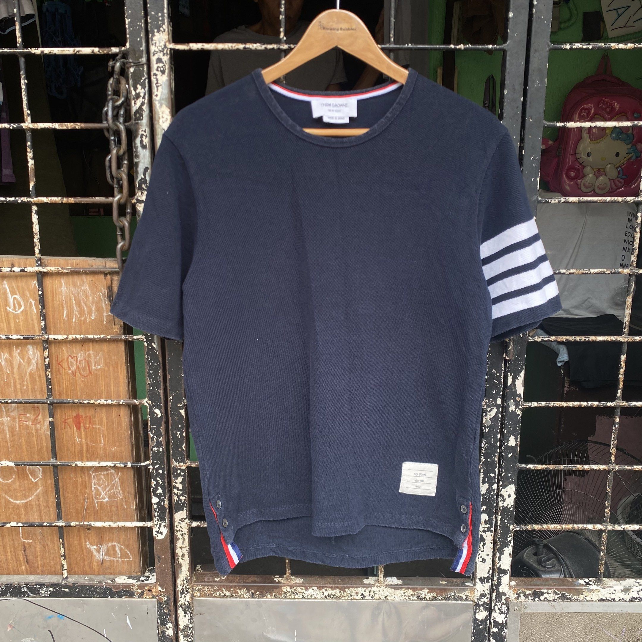 Thom Browne Navy T-shirt with Stripes (Category: Luxury Apparel) located in Manila. Submitted by d____g (Listing ID 1419002861, Image 1). Description: Thone Browne Size:2 W:19 L:27 No issue.