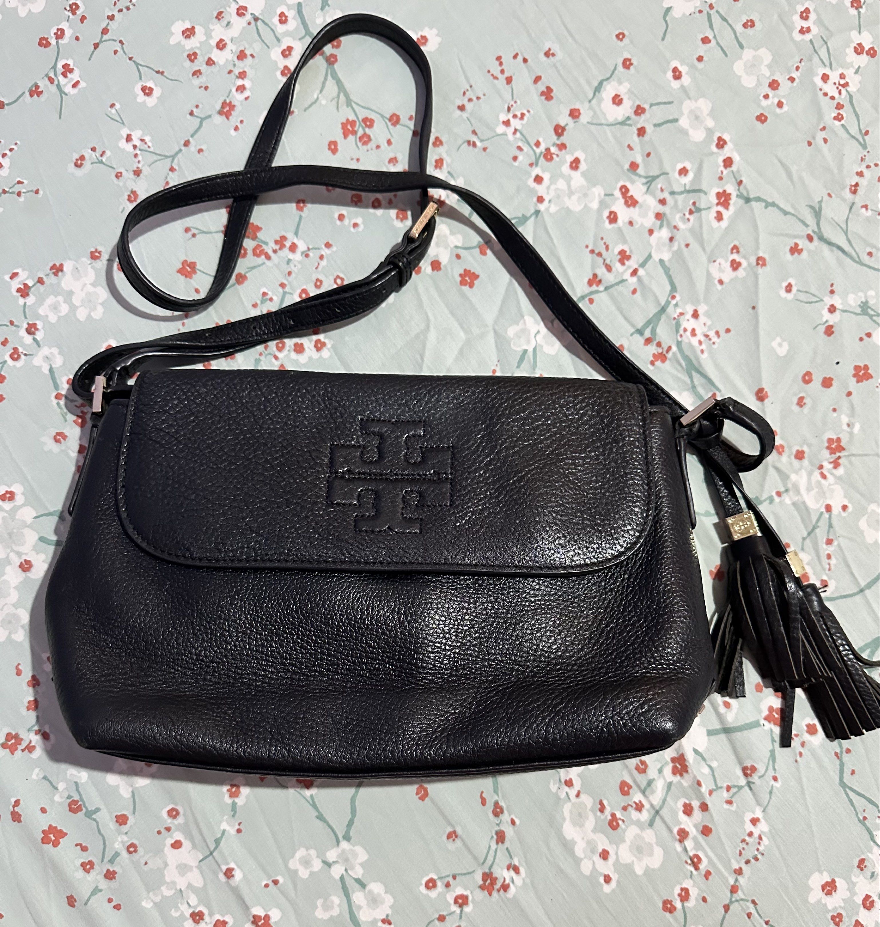 Tory Burch Black Crossbody Bag (Category: Luxury Bags & Wallets) located in Manila. Submitted by mailybullet (Listing ID 1419017252, Image 1). Description: - Tory Burch crossbody bag - Color: Black - Material: Leather - Features: - Flap closure with Tory Burch logo - Detachable shoulder strap - Tassel detail - Perfect for everyday use and special occasions..