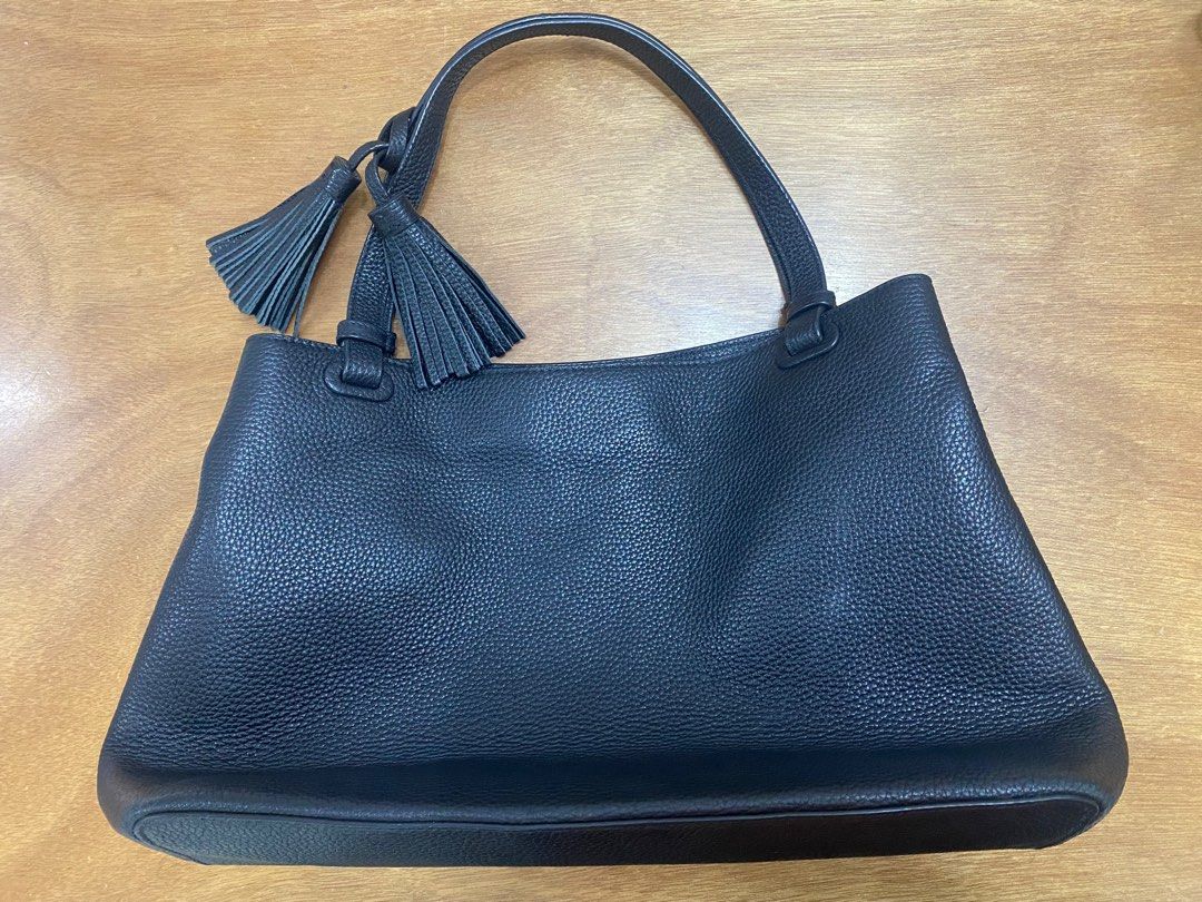 Tory Burch Black Leather Handbag (Category: Luxury Bags & Wallets) located in Manila. Submitted by onebrickatatime (Listing ID 1419030610, Image 3). Description: - 100% authentic - Clean inside & out - No flaws/issues - Tory Burch Thea black pebble leather tote bag with tassels - Top handle design - Stylish tassel detail - Gold-toned zipper - Multiple interior compartments - Branded label inside - Textured leather exterior RFS: Decluttering ***Ne