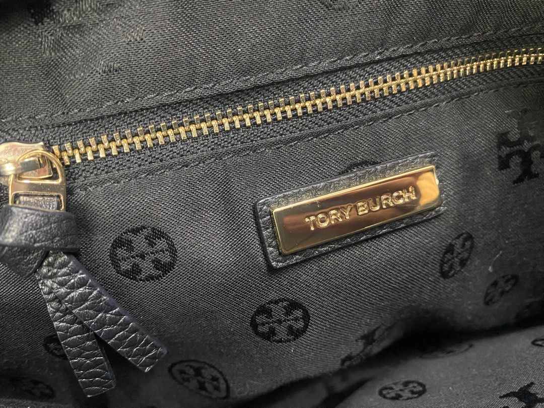 Tory Burch Black Leather Handbag (Category: Luxury Bags & Wallets) located in Manila. Submitted by onebrickatatime (Listing ID 1419030610, Image 2). Description: - 100% authentic - Clean inside & out - No flaws/issues - Tory Burch Thea black pebble leather tote bag with tassels - Top handle design - Stylish tassel detail - Gold-toned zipper - Multiple interior compartments - Branded label inside - Textured leather exterior RFS: Decluttering ***Ne
