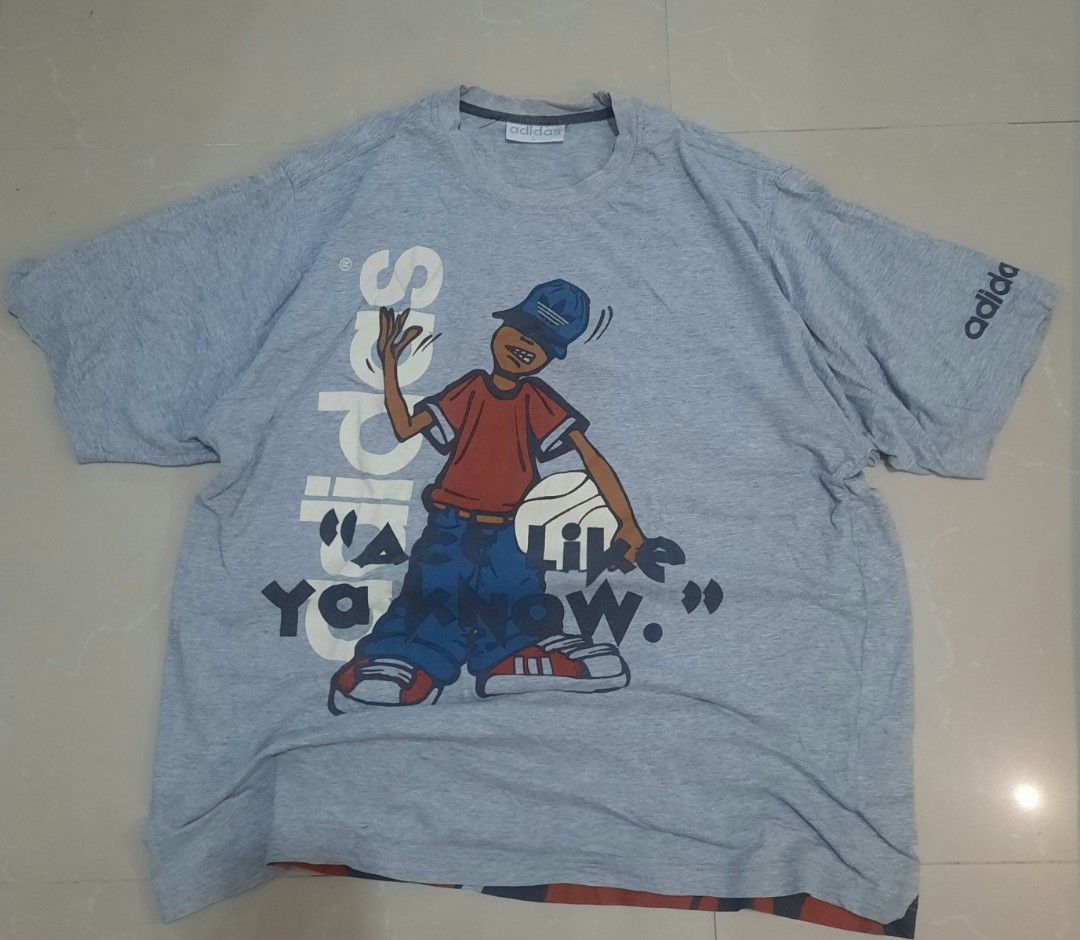 Vintage y2K Adidas Graphic Tee (Category: Tshirts & Polo Shirts ) located in Binan City. Submitted by plut0__ (Listing ID 1419162448, Image 1). Description: dimes shoulder width: 18.5in chest: 21in length: 27.5in sleeve length: 10.5in issues: small hole, small cracks and chips on print, neckline, some unnoticeable stains.