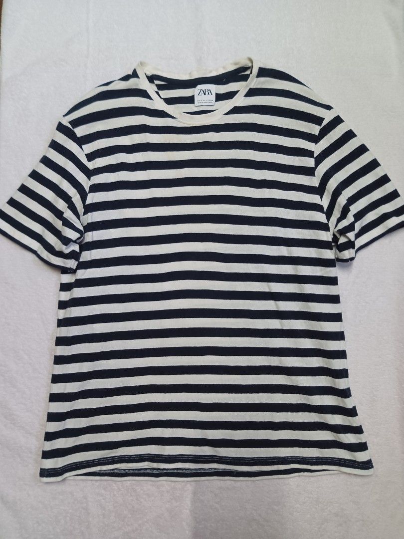 Zara Striped T-shirt (Category: Shirts) located in Malabon City. Submitted by mslalan (Listing ID 1419108820, Image 1). Description: - Zara striped t-shirt - Size: M - Color: Navy and white horizontal stripes - Neckline: Crew neck - Sleeves: Short sleeves - Made in Bangladesh Need wash.