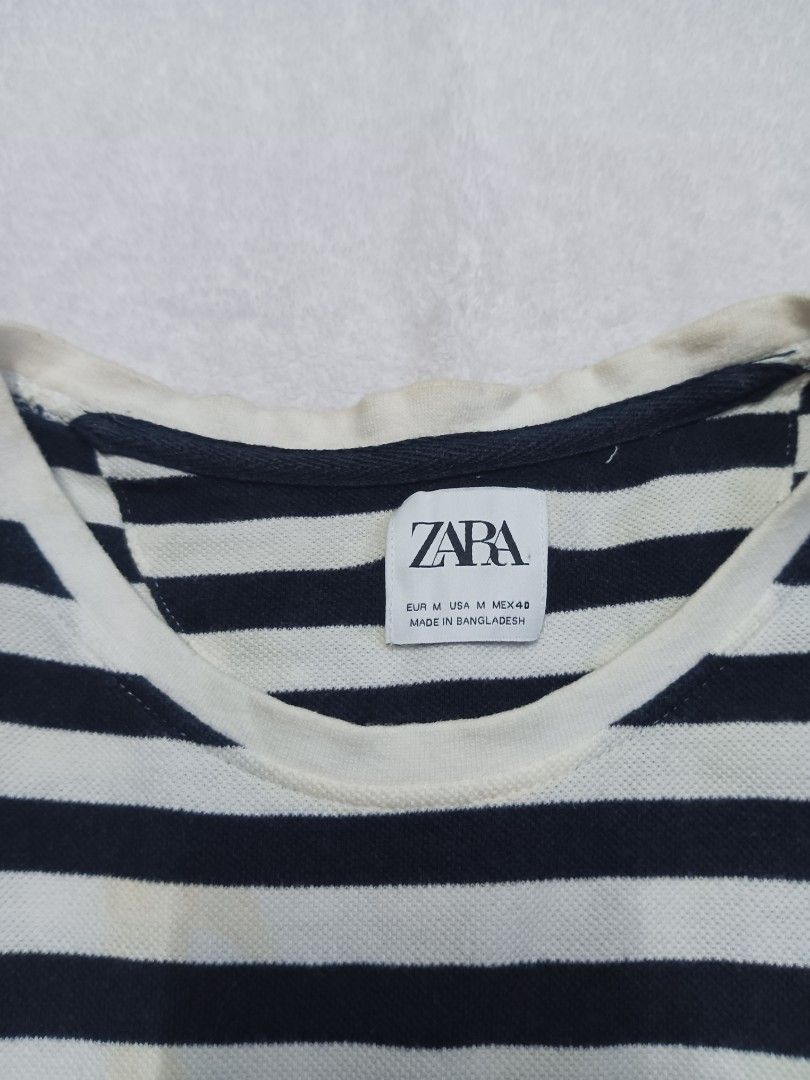 Zara Striped T-shirt (Category: Shirts) located in Malabon City. Submitted by mslalan (Listing ID 1419108820, Image 2). Description: - Zara striped t-shirt - Size: M - Color: Navy and white horizontal stripes - Neckline: Crew neck - Sleeves: Short sleeves - Made in Bangladesh Need wash.